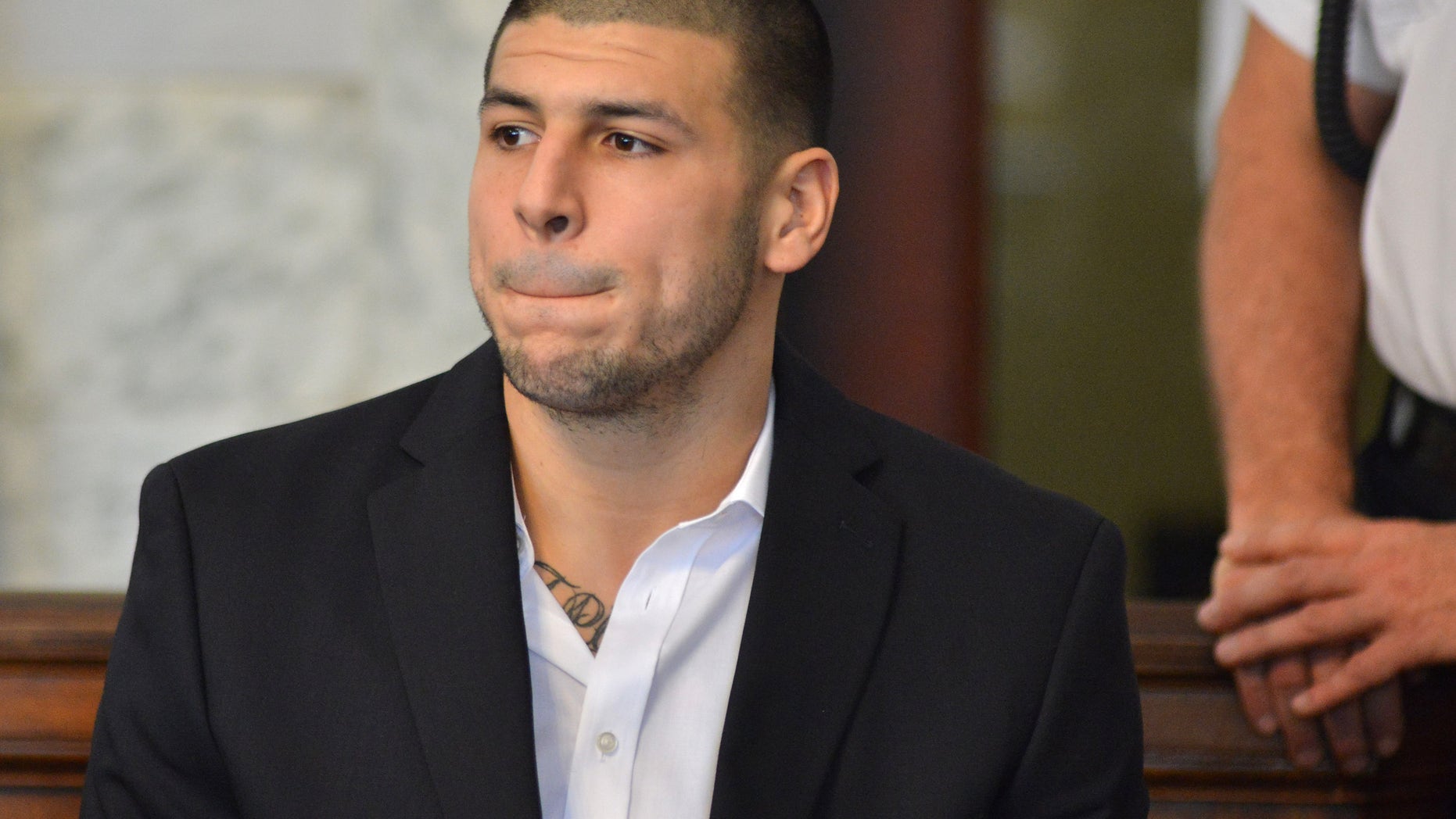 Aug. 22, 2013: Former New England Patriot football player Aaron Hernandez, listens to procedings in a court in Attleboro, Mass.