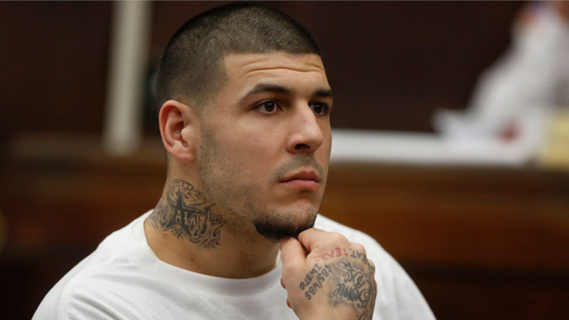 Former New England Patriots NFL football player Aaron Hernandez attends a pre-trial hearing at Suffolk Superior Court, Tuesday, Dec. 22, 2015, in Boston. Hernandez is charged with killing two Boston men in 2012 after a chance encounter at a nightclub. (AP Photo/Steven Senne, Pool)
