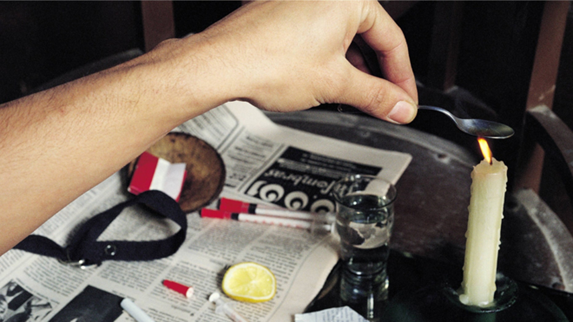 Heroin user preparing his fix Heroin addict heats the drug next to the necessary material to prepare his fix (Photo by Rafa Samano/Cover/Getty Images)