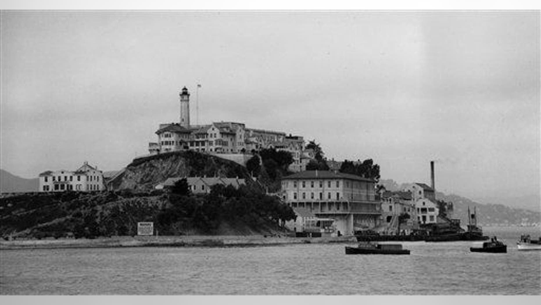 Three armored railroad cars arrive on a car ferry at the United States Penitentiary on Alcatraz Island, San Francisco in August 1934.