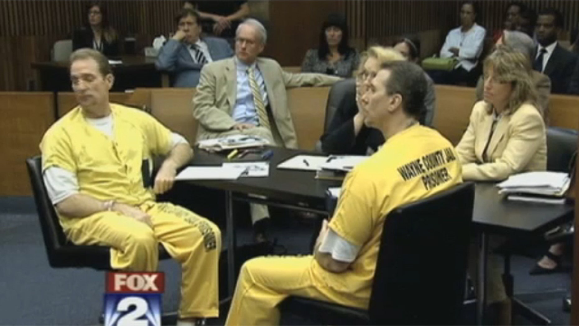 July 30, 2012: The courtroom listens to the judge.