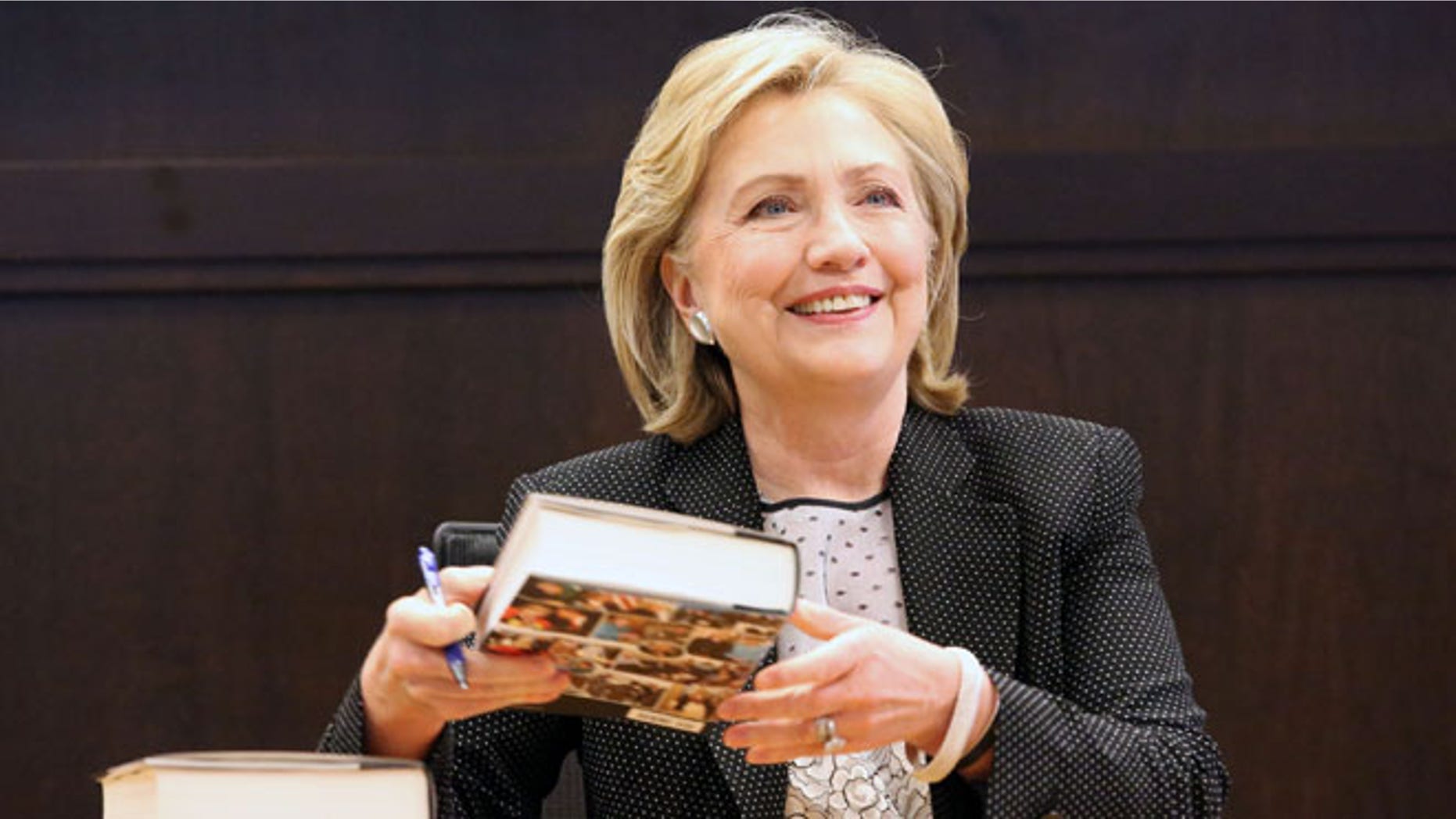 Former Secretary of State Hillary Clinton signs copies of her new book "Hard Choices" Barnes & Noble at The Grove in Los Angeles Thursday, June 19, 2014.
