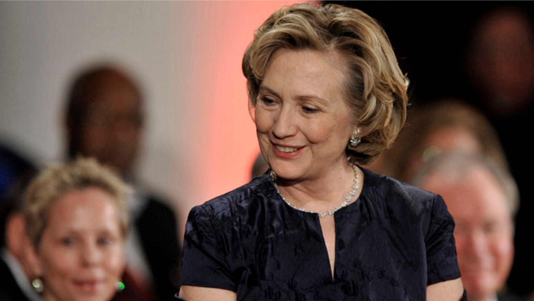 Hillary Clinton prepares to receive the Order of Lincoln Award from Illinois Gov. Pat Quinn at the Field Museum in Chicago, Saturday, May 3, 2014.