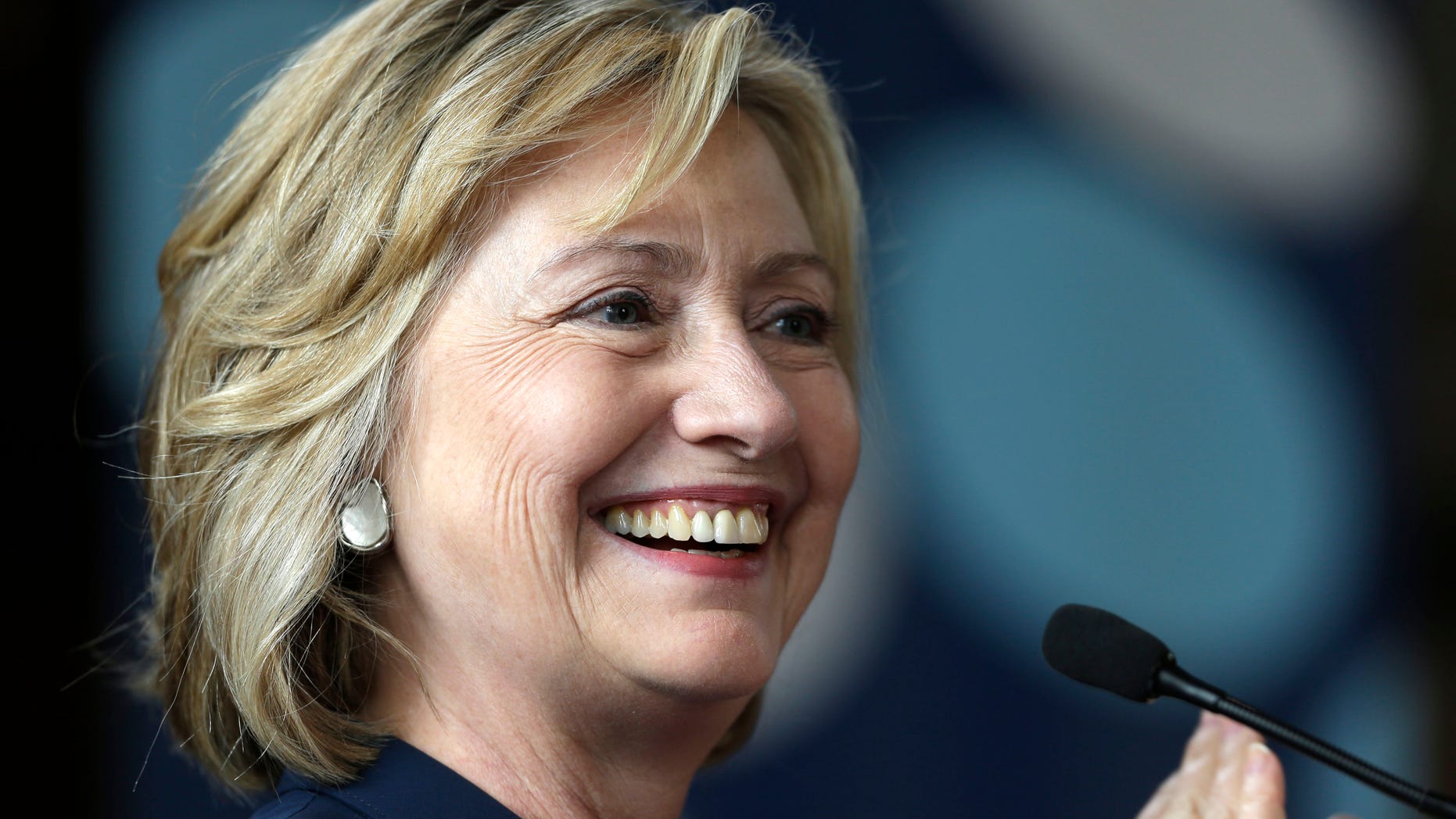 July 9, 2013: Former Secretary of State Hillary Clinton applauds international delegates to the during the Women in Public Service Project leadership symposium, at Bryn Mawr College.
