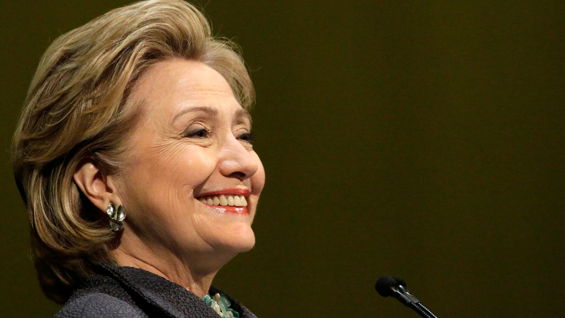 Former Secretary of State Hillary Rodham Clinton smiles out to the crowd in Chicago, Wednesday, June 11, 2014, during an event to promote her new book. Hillary Clinton is returning to New York on Thursday for more stops on her book promo blitz. The former secretary of state and potential 2016 presidential contender will be making multiple stops in the city on Thursday. (AP Photo/Stacy Thacker)