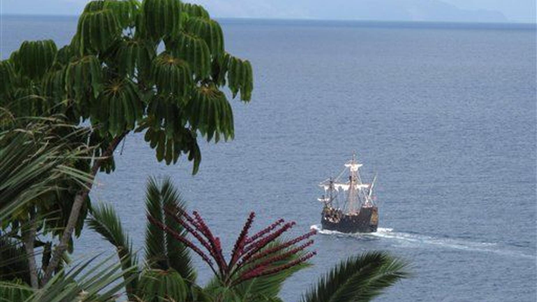 In this photo taken Sept. 12, 2011, a replica of Christopher Columbus' flagship, the Santa Maria, makes its way past the Portuguese island of Madeira.