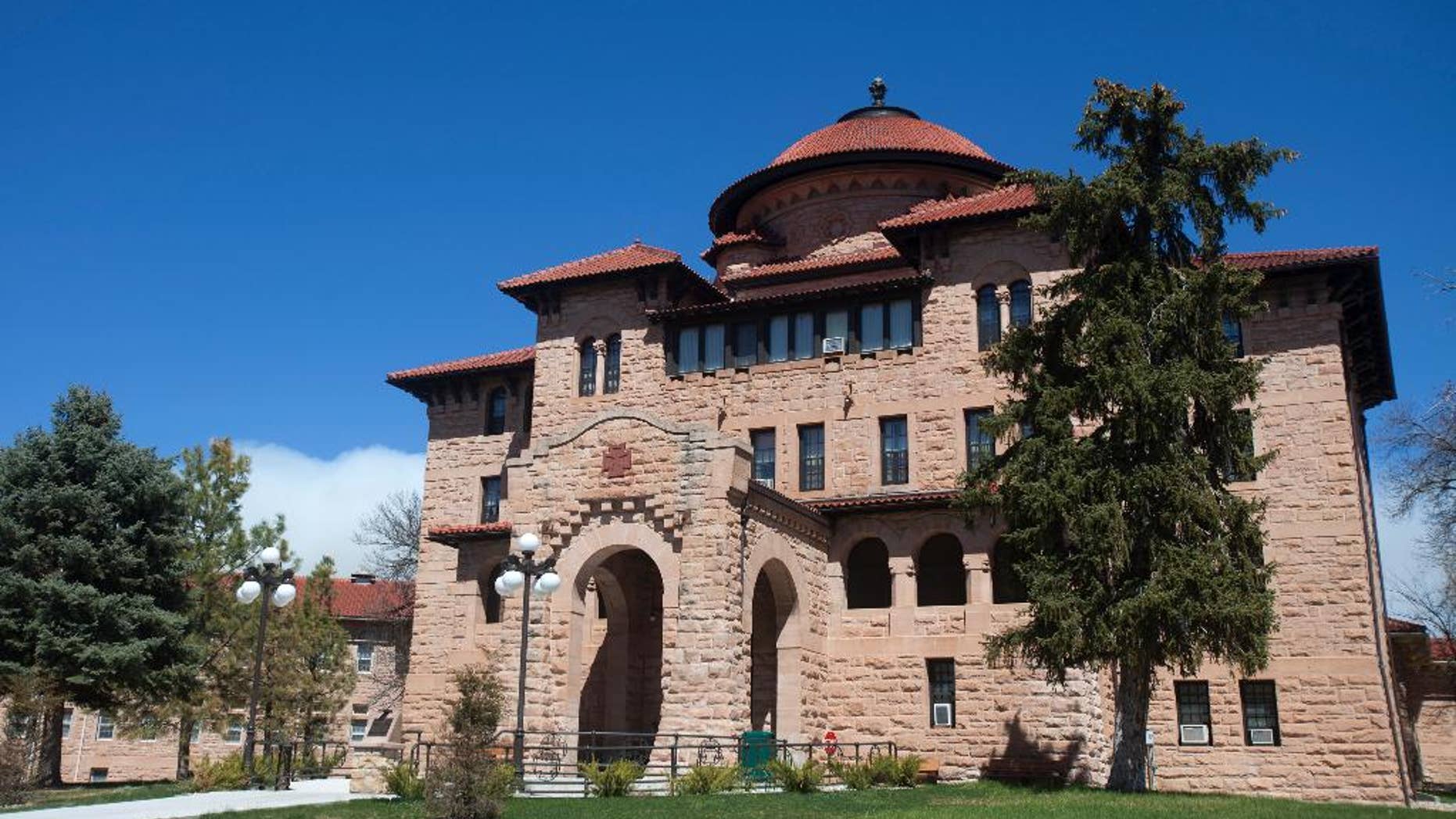 This photo taken April 13, 2015, shows exterior of the grand rotunda entry to the historic Black Hills VA in Hot Springs, S.D. The 108-year-old veteran’s hospital built of thick blocks of pink sandstone and topped with red, tiled roofs in a Spanish mission-style overlooks the tiny town of Hot Springs, a scenic escape that’s become a haven known for healing veterans over the last century. (AP Photo/Kristina Barker)