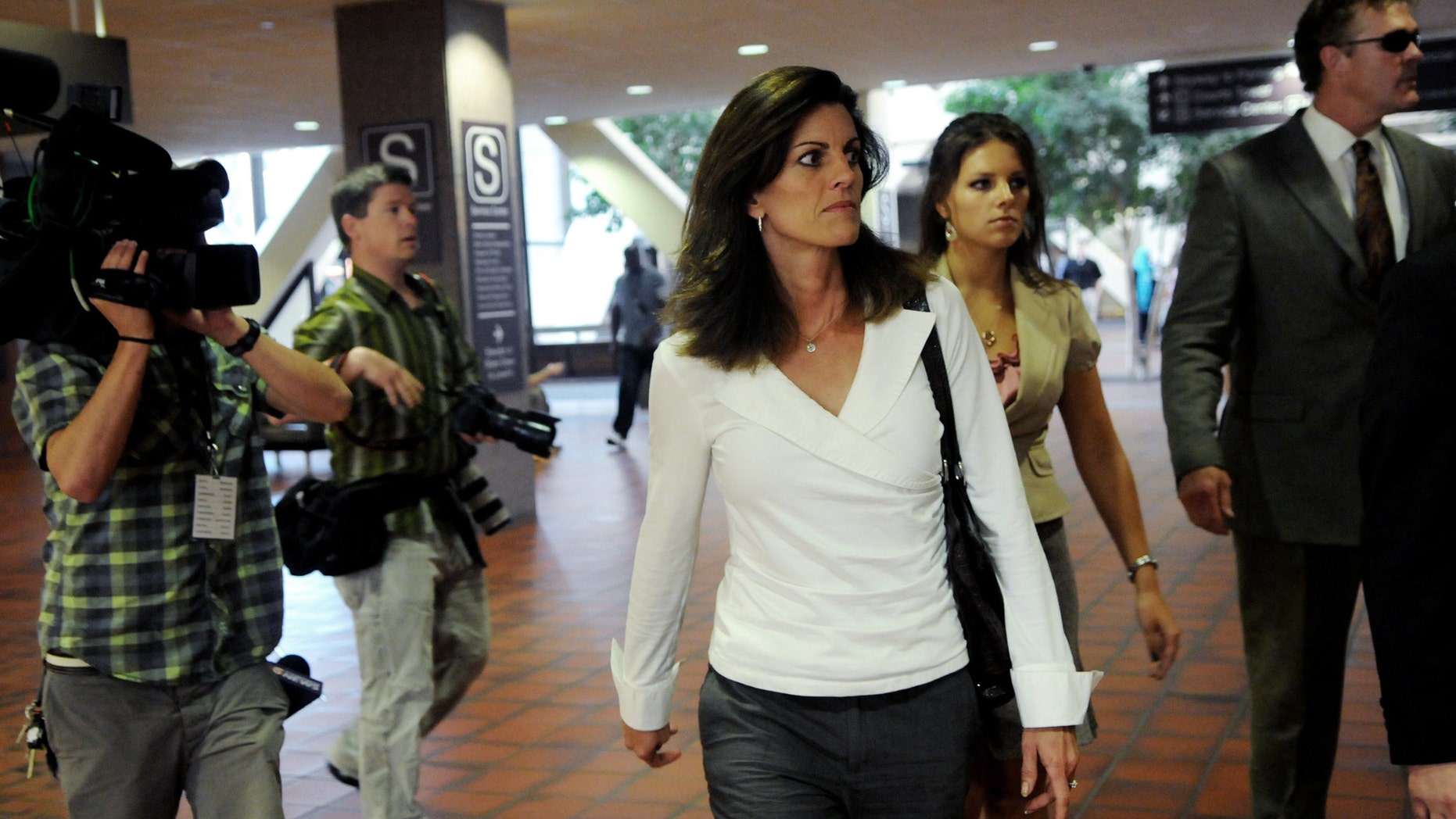 May 3: Amy Senser and her attorney Eric Nelson enter the Hennepin County Government Center before hearing the jury's verdict in her hit-and-run case on Thursday in Minneapolis. Amy Senser was convicted of leaving the scene of an accident and failure to promptly report an accident, both criminal vehicular homicide charges, in the August death of Anousone Phanthavong. She was acquitted of a third felony charge of gross negligence. She was also convicted of misdemeanor careless driving.