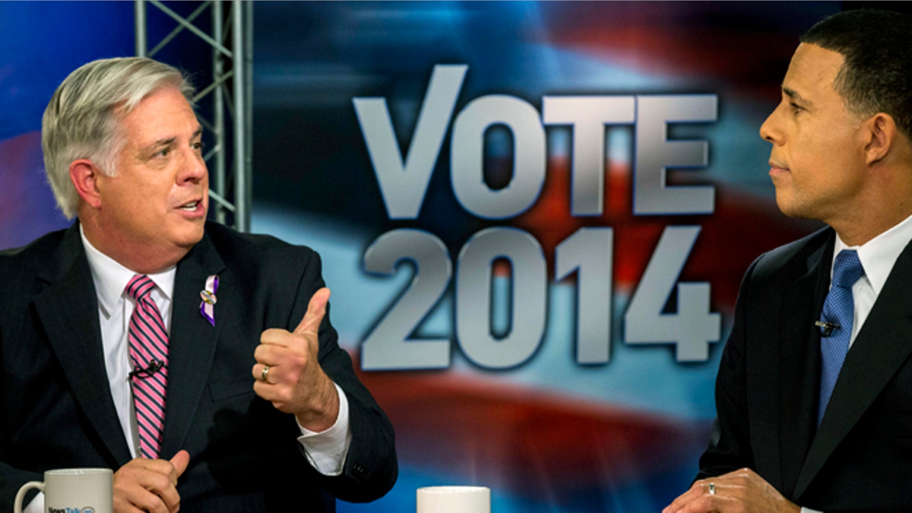 FILE: Oct. 13, 2014: Maryland gubernatorial candidates Larry Hogan, left, and Lt. Gov. Anthony Brown debate in Arlington, Va.