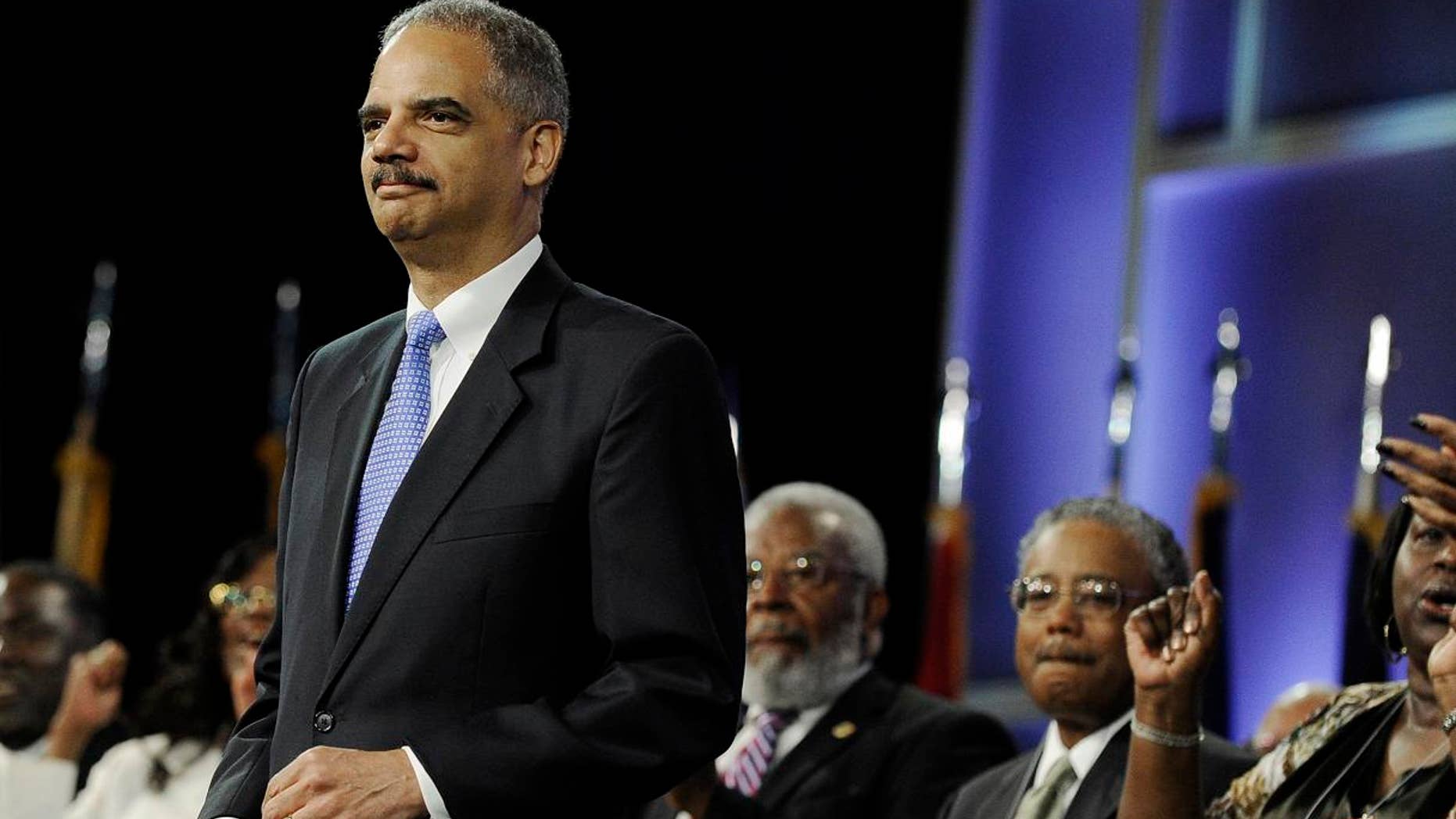 July 10: Attorney General Eric Holder is welcomed at the NAACP annual convention in Houston.