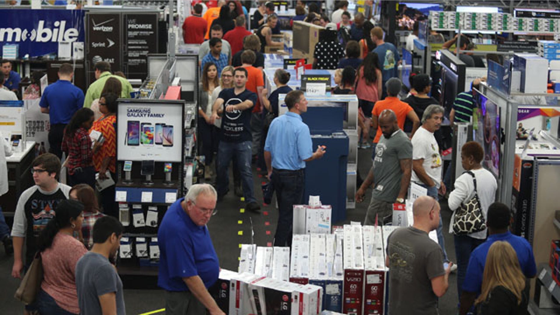 Nov. 26, 2015: People look at merchandise while holiday shopping at Best Buy in Panama City, Fla. (Patti Blake/News Herald via AP)