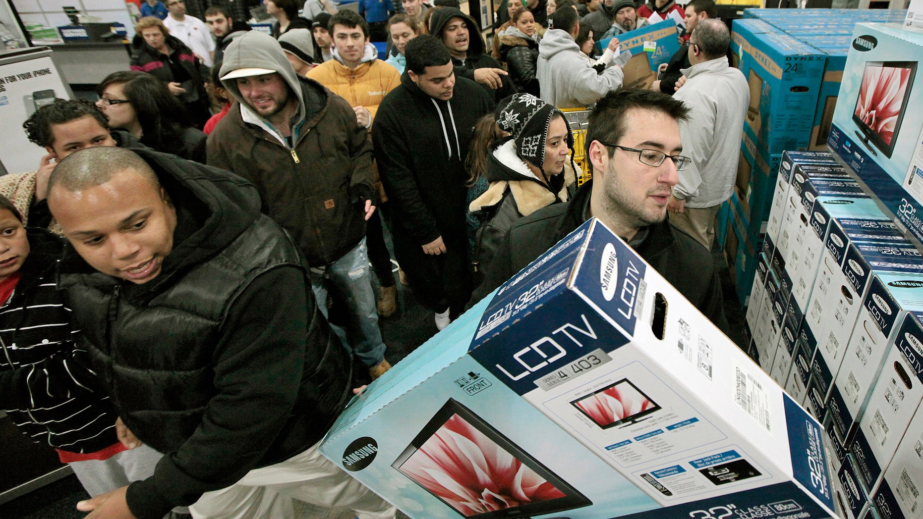Nov. 25, 2011: Black†Friday shoppers rush into Best Buy in North Dartmouth, Mass.