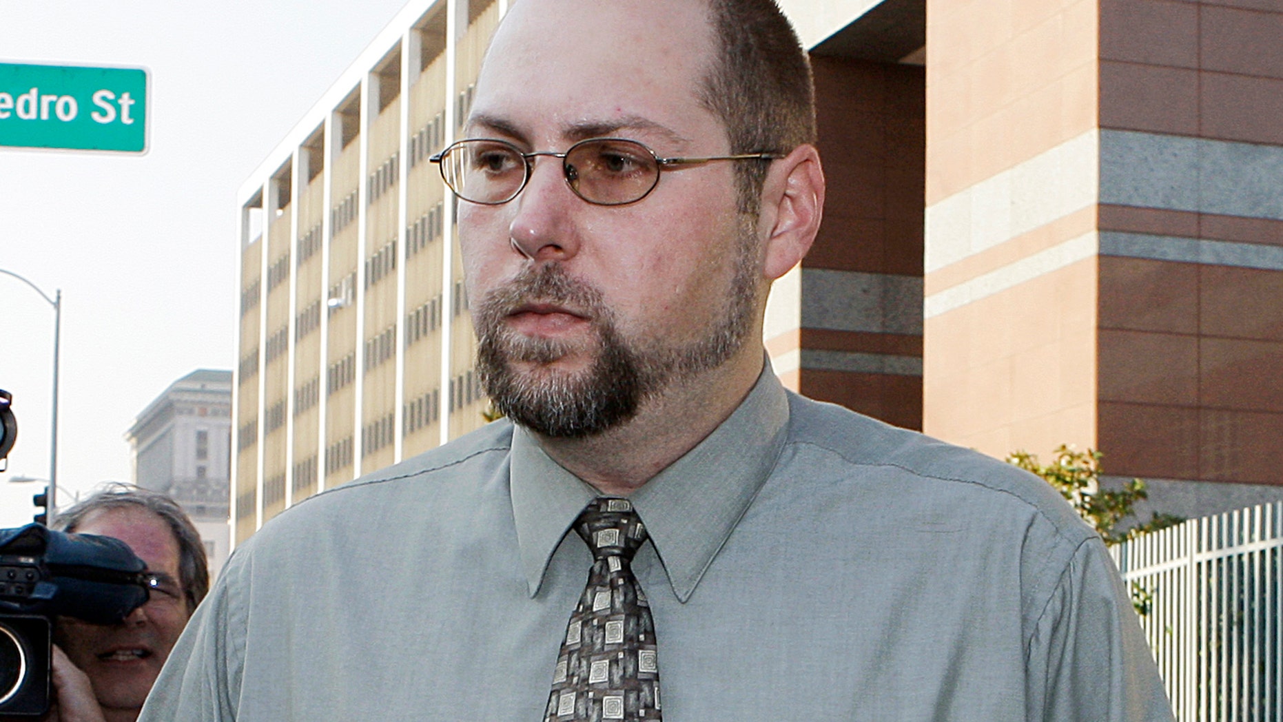 FILE - In this Nov. 1, 2011 file photo, Christopher Chaney, 35, of Jacksonville, Fla., leaves federal court in Los Angeles. Chaney has agreed to plead guilty to hacking into the email accounts of celebrities such as Christina Aguilera, Mila Kunis and Scarlett Johansson, whose nude photos eventually landed on the Internet, according to court documents filed Thursday, March 22, 2012. Long before Christopher Chaney made headlines by hacking into the email accounts of such stars as Scarlett Johansson and Christina Aguilera, he honed his craft at the expense of two women who say he harassed them and stalked them online. (AP Photo/Reed Saxon, File)