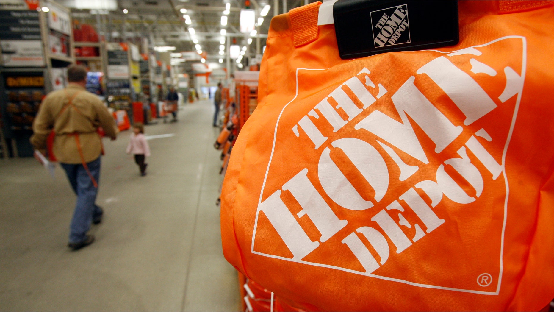 FILE - In this Feb. 22, 2010 file photo, shoppers walk through the aisles at the Home Depot store in Williston, Vt. The Home Depot on Thursday, Sept. 18, 2014 said it has eliminated malware from its U.S. and Canadian networks that affected 56 million unique payment cards between April and September. (AP Photo/Toby Talbot, File)