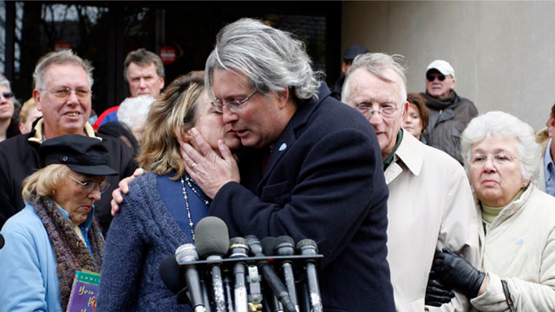 Nov. 8: Hanna Chapman, left, hugs her brother Dr. William Petit Jr. following the sentence given to Steven Hayes, not pictured, following jury deliberations at the New Haven, Conn., County Courthouse. Hayes' lawyers asked for a two-month delay in sentencing to investigate their client's constitutional right to a fair trial amid heavy publicity.