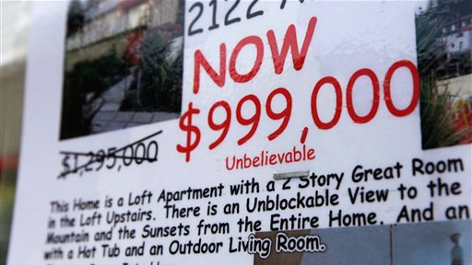 June 2011: A condo with a view and a reduced price is advertised for sale, in Seattle.