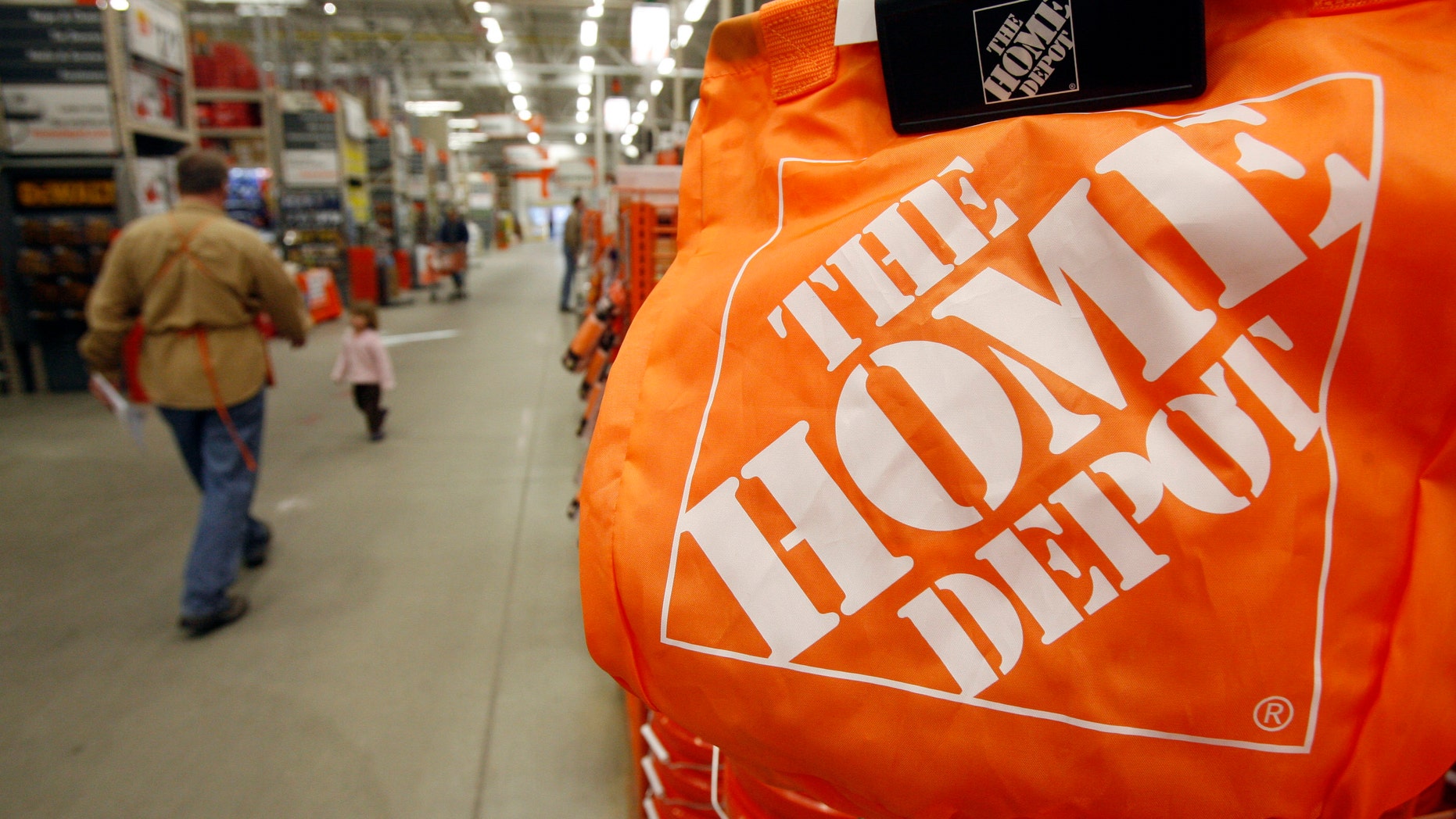 FILE - In this Feb. 22, 2010 file photo, shoppers walk through the aisles at the Home Depot store in Williston, Vt. The Home Depot on Thursday, Sept. 18, 2014 said it has eliminated malware from its U.S. and Canadian networks that affected 56 million unique payment cards between April and September. (AP Photo/Toby Talbot, File)