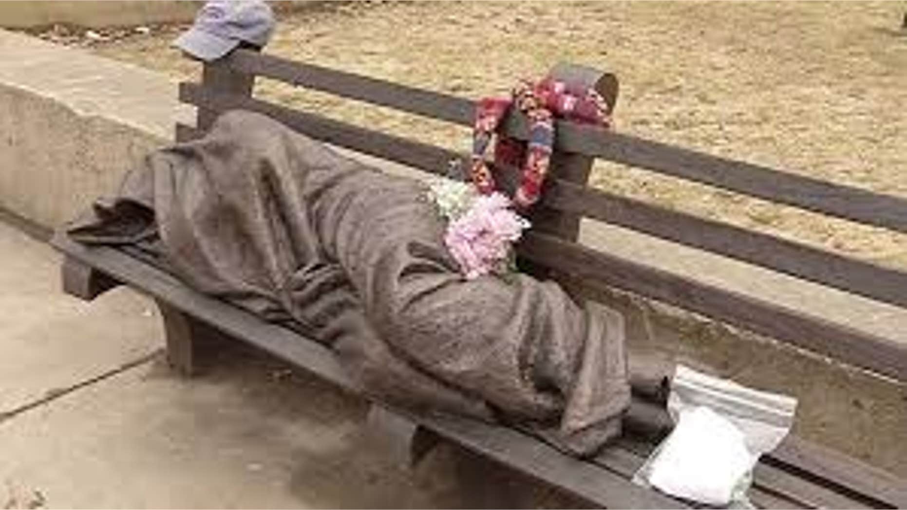 April 3, 2015: An image from video shows a work by Canadian sculptor Timothy Schmalz, a blanket-shrouded Jesus identifiable only by the crucifixion wounds on his feet, outside St. Paul's Episcopal Cathedral in Buffalo, NY.