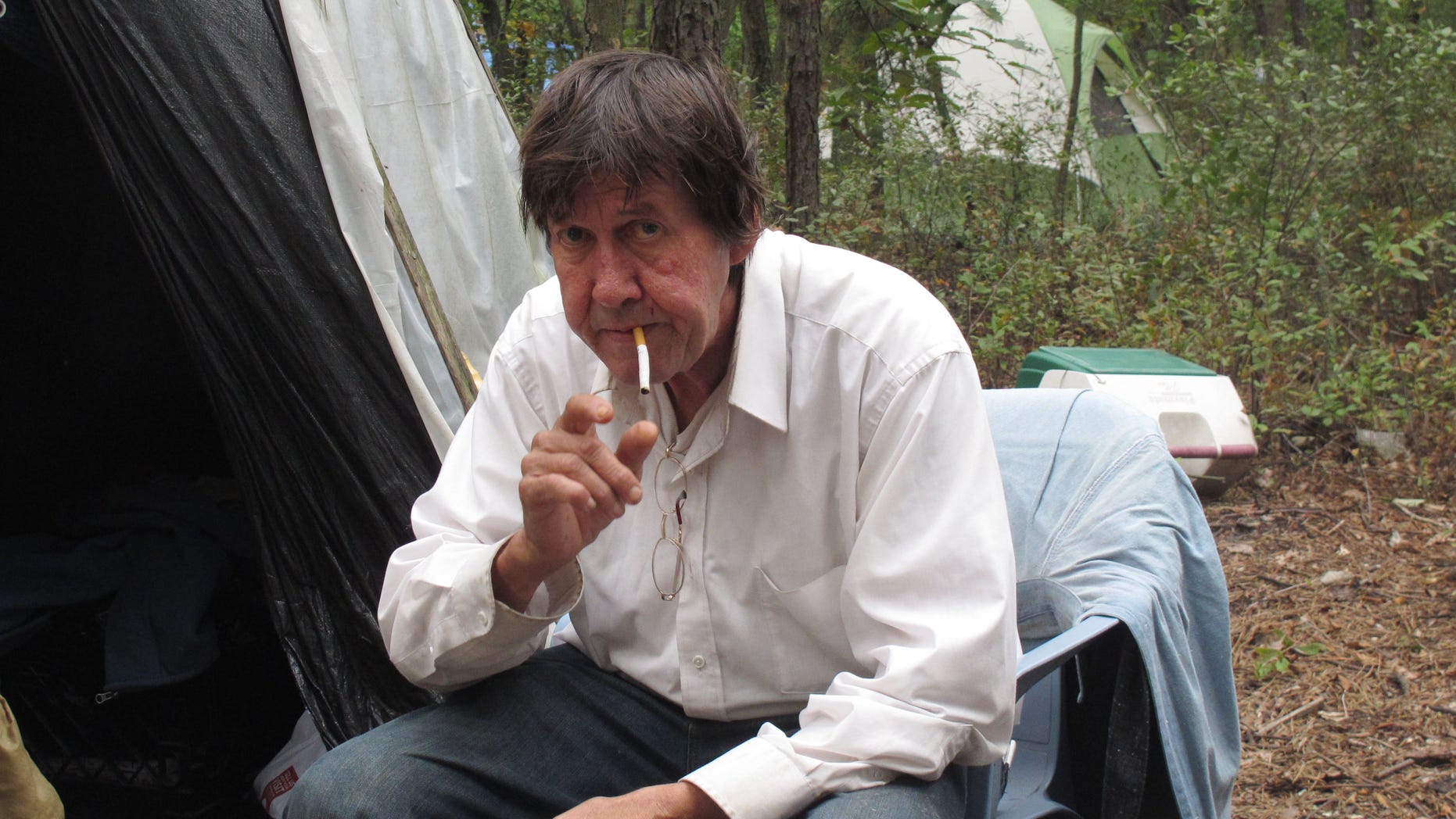 Oct. 4, 2012 - Douglas Hardman prepares to light a cigarette outside the teepee in which he lives in an encampment of homeless people in Lakewood N.J.