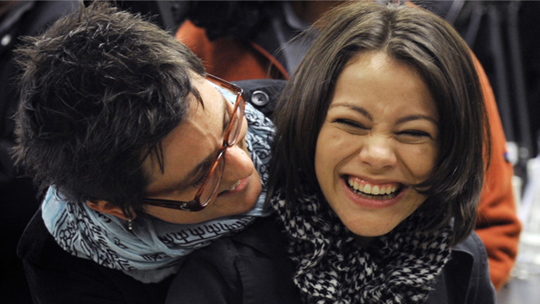 Jan. 13: Intel Semifinalist Samantha Garvey, 17, right, gets a hug from her science research teacher.