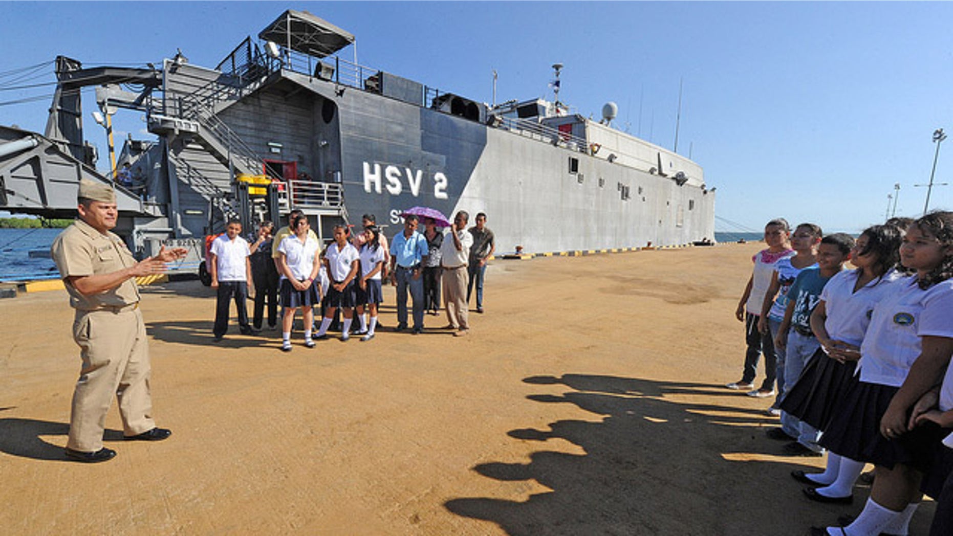 110303-N-WX845-025
SAN LORENZO, Honduras (March 3, 2011) Chief Hospital Corpsman Carls Enriquez, left, greets Basic Education Center Jose Cecilio del Valle students and faculty before touring High Speed Vessel Swift (HSV 2) in support of Southern Partnership Station (SPS) 2011. SPS is an annual deployment of U.S. ships to the U.S. Southern Command area of responsibility in the Caribbean and Latin America. (U.S. Navy photo by Mass Communication Specialist 1st Class Jeffery Tilghman Williams/Released)