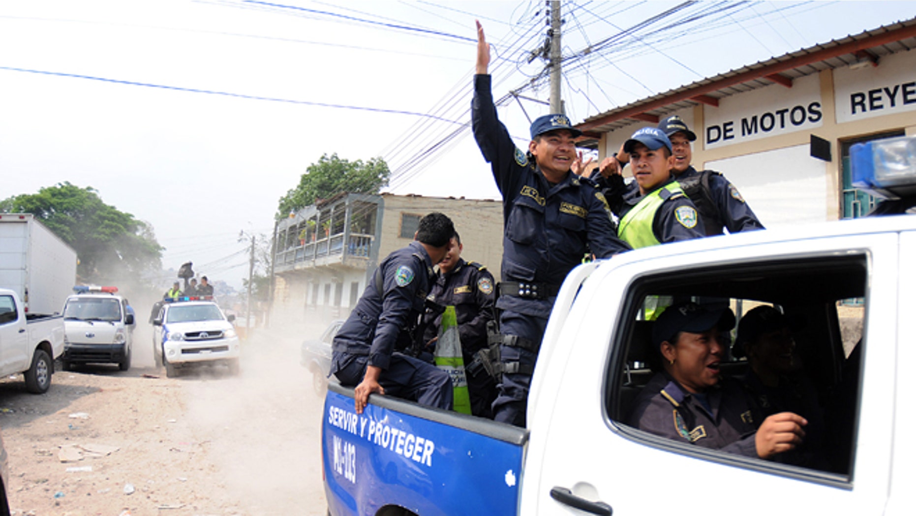 Honduras national policemen arrive at a police district after a work stoppage was declared in Tegucigalpa, Honduras, Tuesday April 23, 2013. About 1800 policemen have started a work stoppage to demand that the government improve working conditions for the police. The work stoppage comes at a time when the national police is being strongly criticized for the poor results fighting crime with statistics that place Honduras as one of the most violent countries in the world, holding a homicide rate of 91 per 100,000 residents. (AP Photo/Fernando Antonio)