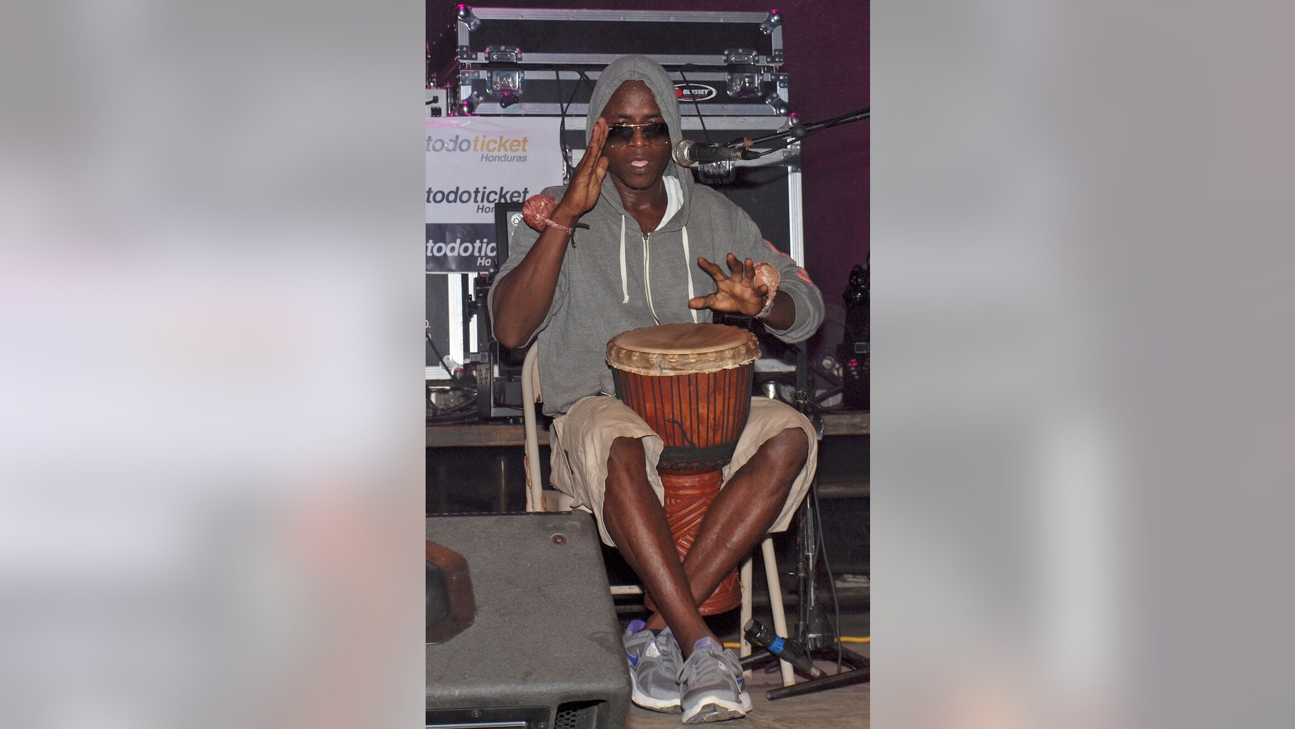 Aug. 31, 2013: In this photo, Lenin Roberto Arana, whose stage name is Canario, plays a traditional Garifuna drum during a concert in Roatan, Honduras.