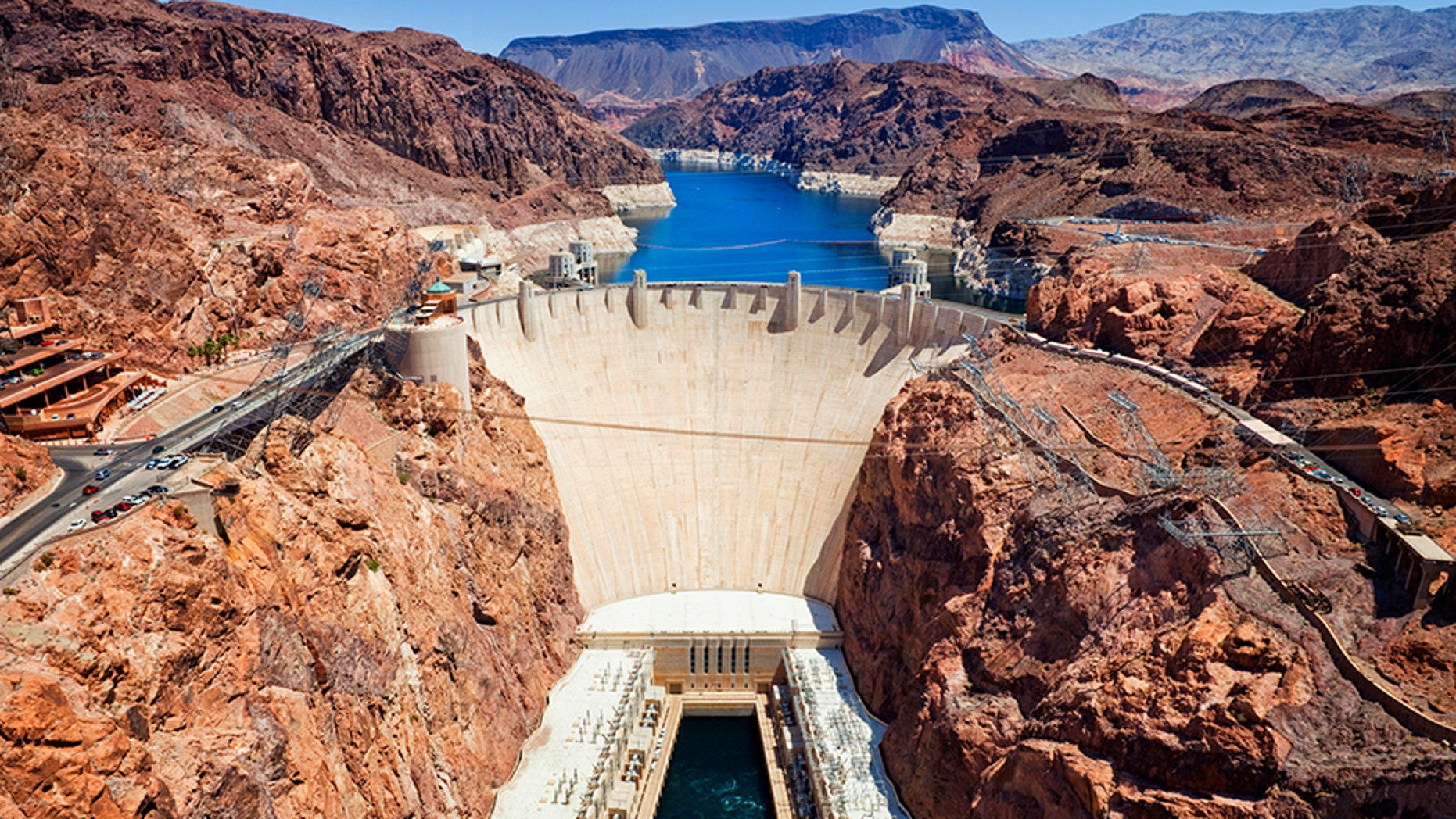 A man, possibly armed, barricaded himself inside an armored vehicle somewhere near the Hoover Dam and U.S. Highway 93 southbound, reports say.