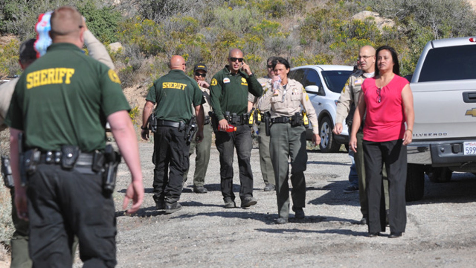 April 9, 2015: Law enforcement personnel search for a suspect who stole a horse and fled into the mountains near Deep Creek in Apple Valley, Calif. A Southern California sheriff on Thursday ordered an immediate investigation after deputies were recorded beating and kicking the suspect. (AP Photo/The Victor Valley Daily Press, David Pardo)