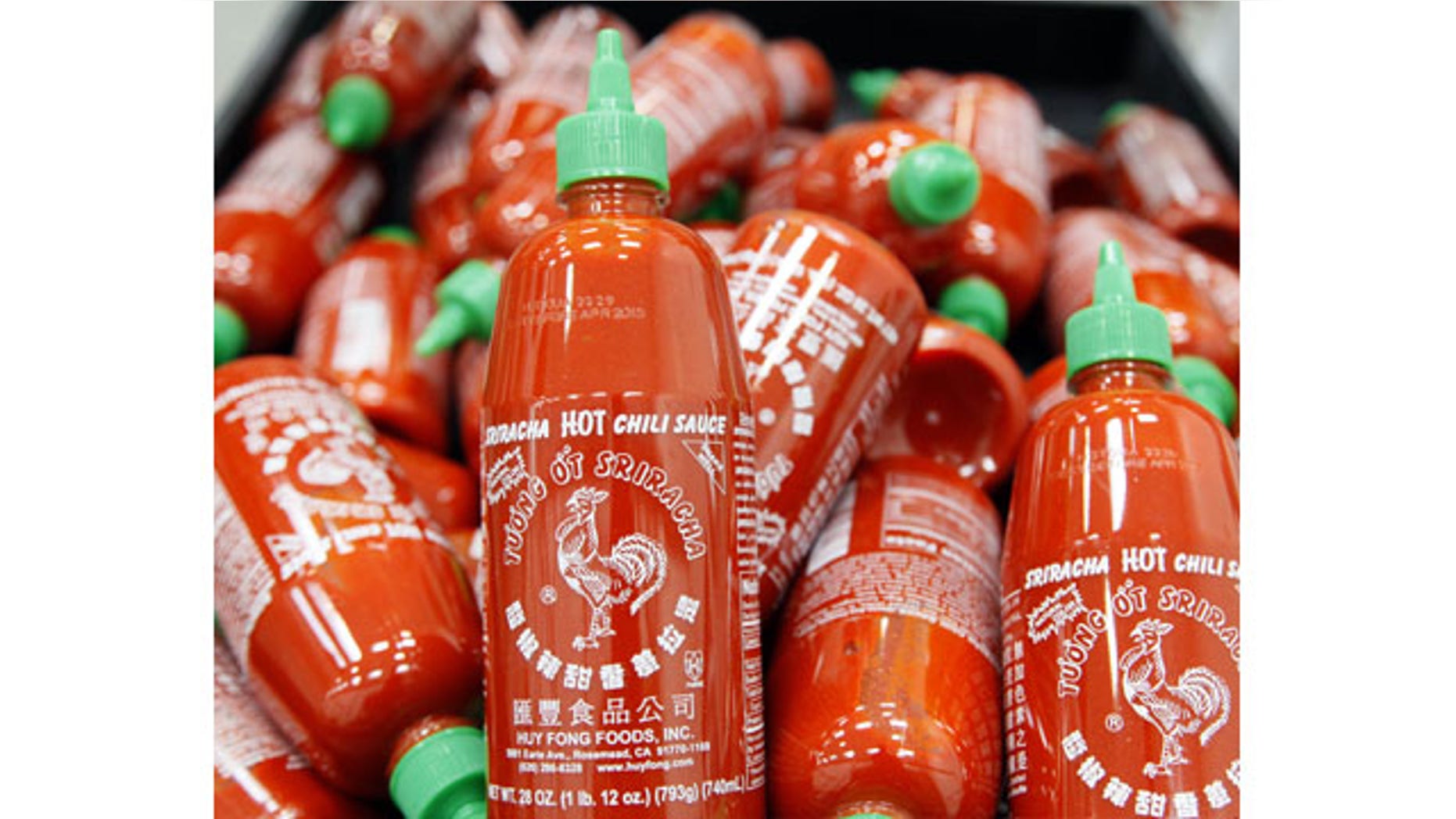 October 29, 2013: Sriracha chili sauce bottles are produced at the Huy Fong Foods factory in Irwindale, Calif. The maker of Sriracha hot sauce is under fire for allegedly fouling the air around its Southern California production site. (AP Photo)