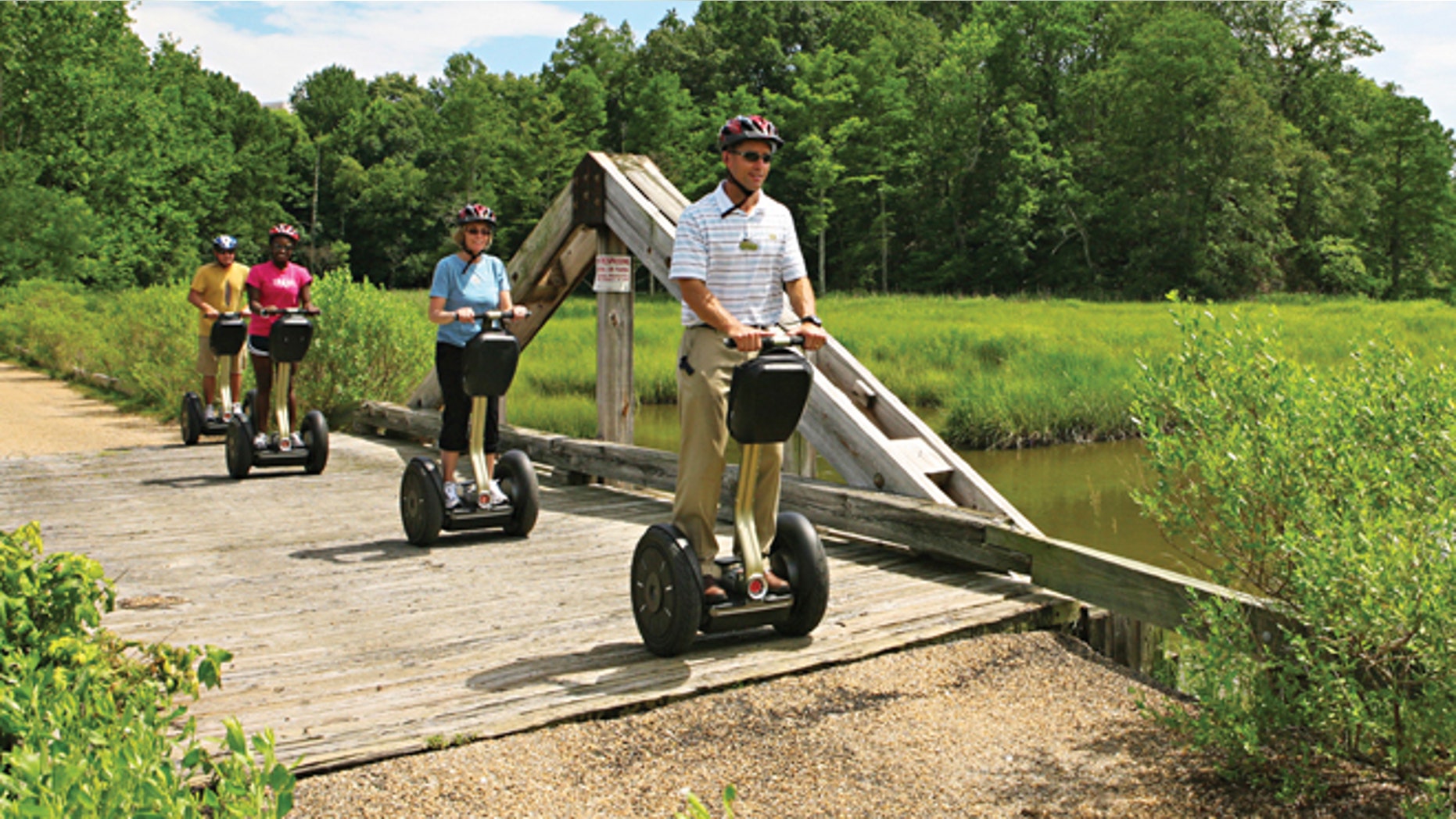 Kingsmill Resorts director of sports, Kevin Dry, leads a Segway tour on the resorts grounds in Williamsburg, Va.