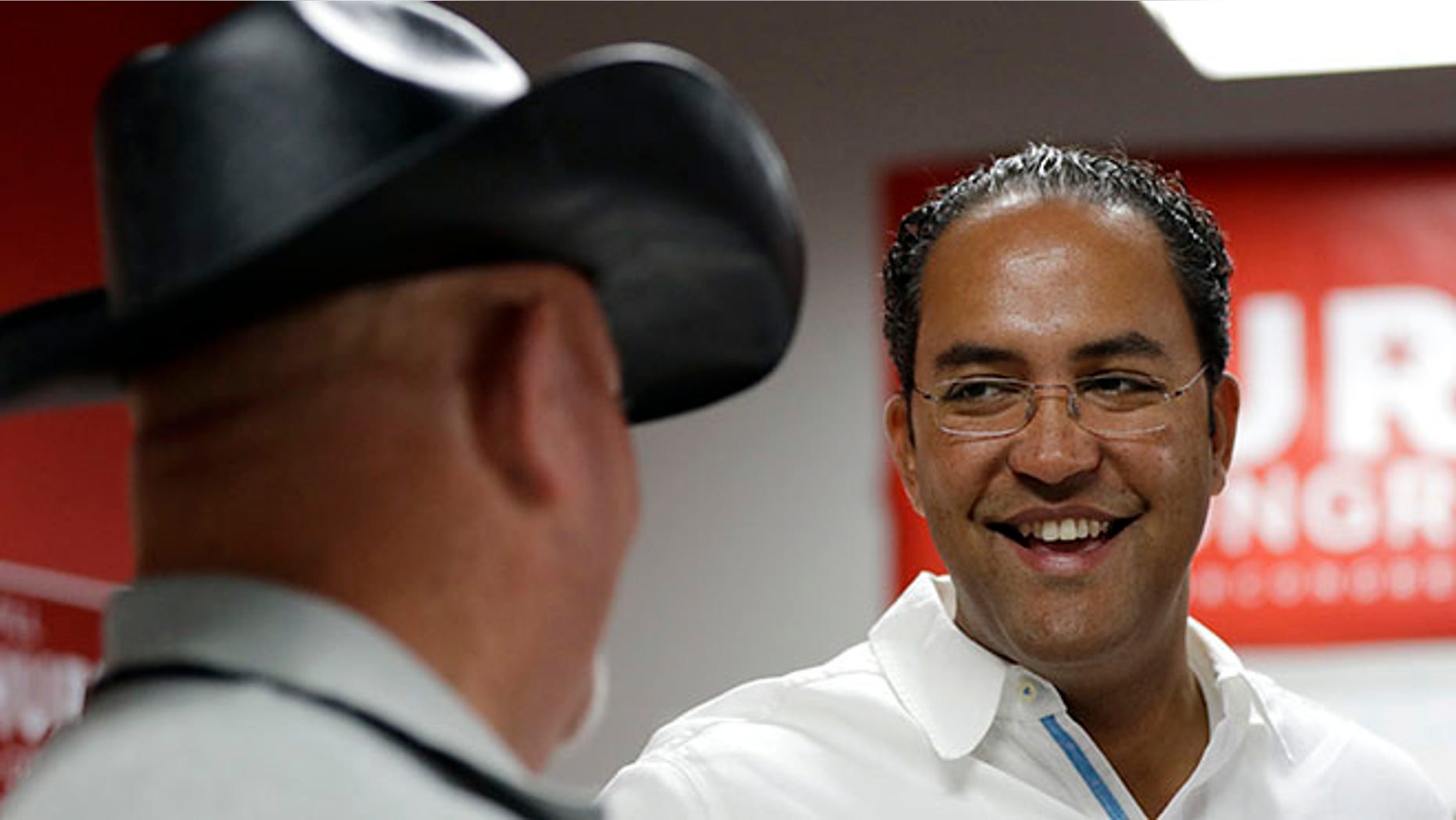 First-term Republican Rep. Will Hurd with a supporter at a campaign office, in San Antonio.