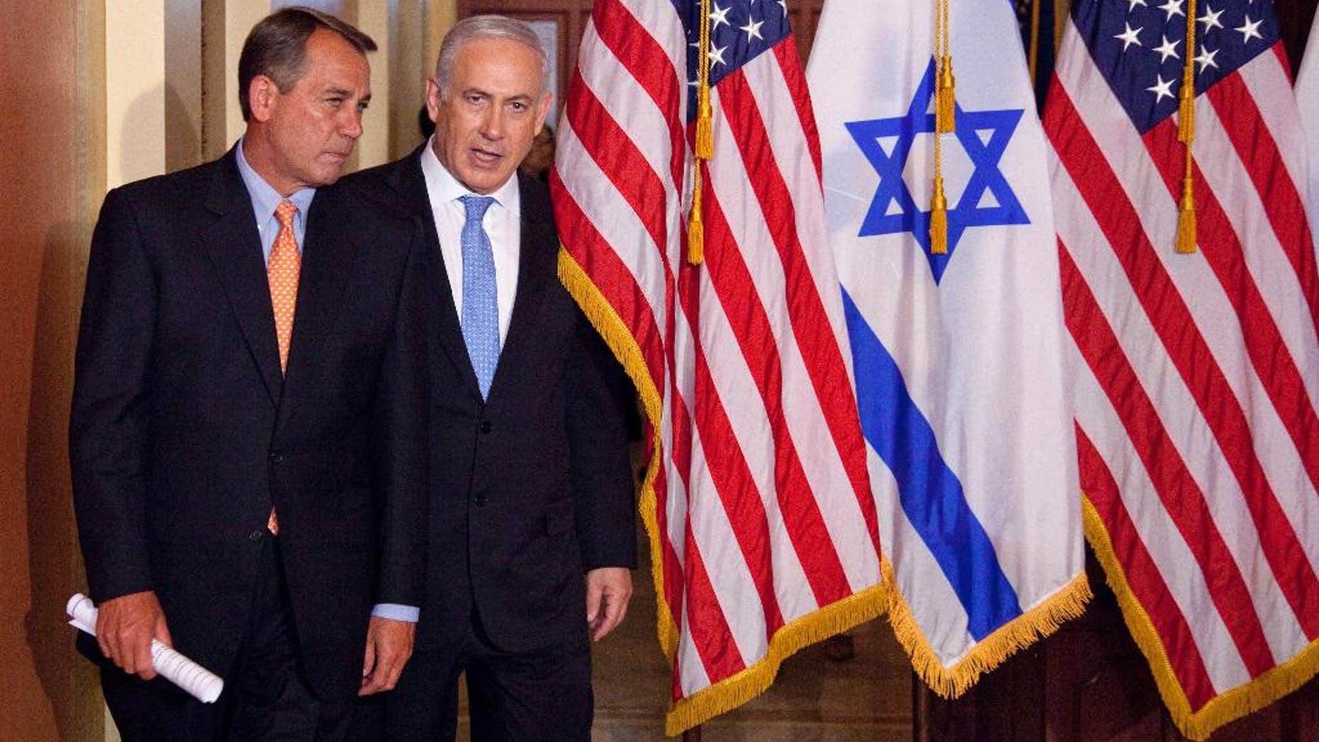FILE - In this May 24, 2011 file photo, Israeli Prime Minister Benjamin Netanyahu walks with House Speaker John Boehner of Ohio on Capitol Hill in Washington. Israel’s ambassador to the US has gotten an earful from a half-dozen House Democrats angered by Prime Minister Benjamin Netanyahu’s acceptance of a Republican invitation to address Congress next month. Boehner’s invitation came with the Obama administration in negotiations with Iran over its nuclear program. Boehner’s move has angered the White House and Democrats. (AP Photo/Evan Vucci, File)