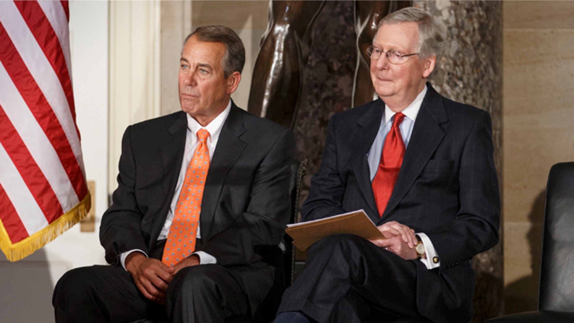 House Speaker John Boehner of Ohio, and Senate Majority Leader Mitch McConnell of Ky. attend a statue unveiling ceremony honoring former Arizona Sen. Barry Goldwater, Wednesday, Feb. 11, 2015, on Capitol Hill in Washington. Boehner and McConnell are at a standstill over provisions attached to a Homeland Security spending bill aimed at blocking President Barack Obama's executive actions on immigration. McConnell declared a Senate stalemate Tuesday and called on the House to make the next move to avoid an agency shutdown. House Republicans said they had no intention of doing so and today, Wednesday, Feb. 11, 2015, Speaker Boehner declared that Senate Democrats should "get off their ass" and pass a bill to fund the Homeland Security Department and restrict President Barack Obama's executive moves on immigration. (AP Photo/J. Scott Applewhite)