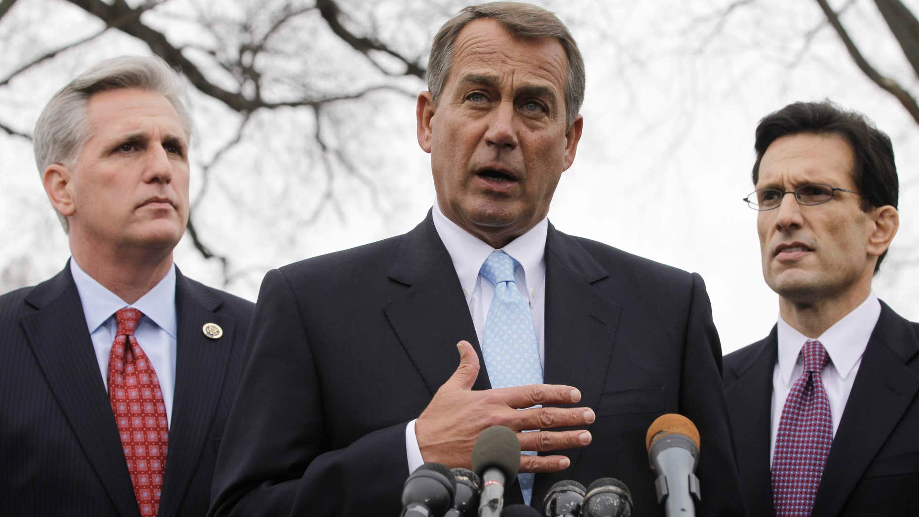 In this Feb. 9, 2011, file photo House Speaker John Boehner of Ohio, center, with House Majority Leader Eric Cantor of Va., right, and House Majority Whip Kevin McCarthy of Calif., speaks to reporters outside the White House in Washington. (AP)