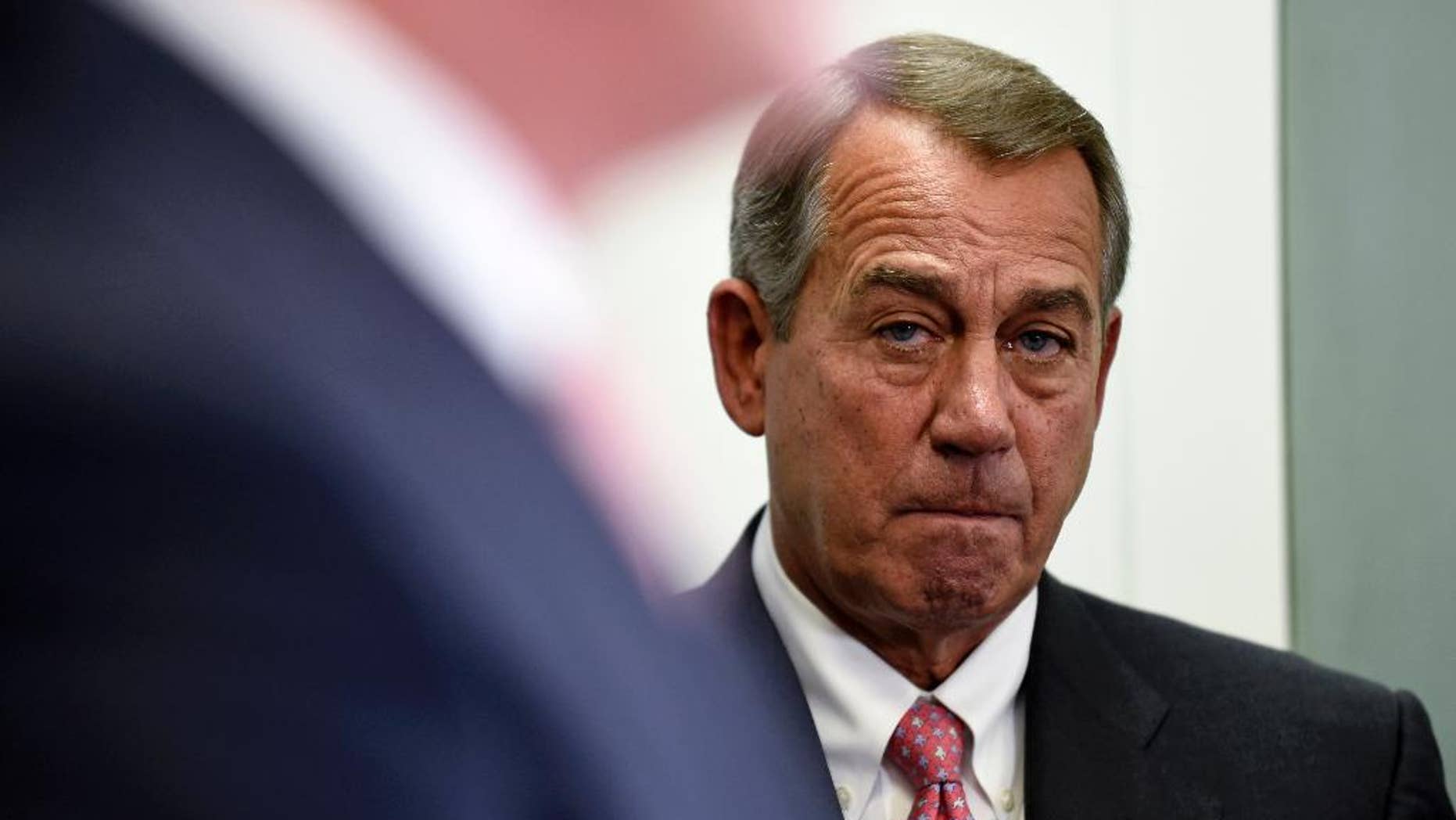 House Speaker John Boehner of Ohio listens during a news conference on Capitol Hill in Washington, Wednesday, May 13, 2015. The House debates and votes for final passage on NSA Surveillance legislation, known as the USA Freedom Act. The measure seeks to codify President Barack Obama's proposal to end the NSA's collection of domestic calling records. It would allow the agency to request certain records held by the telephone companies under a court order in terrorism investigations. (AP Photo/Susan Walsh)