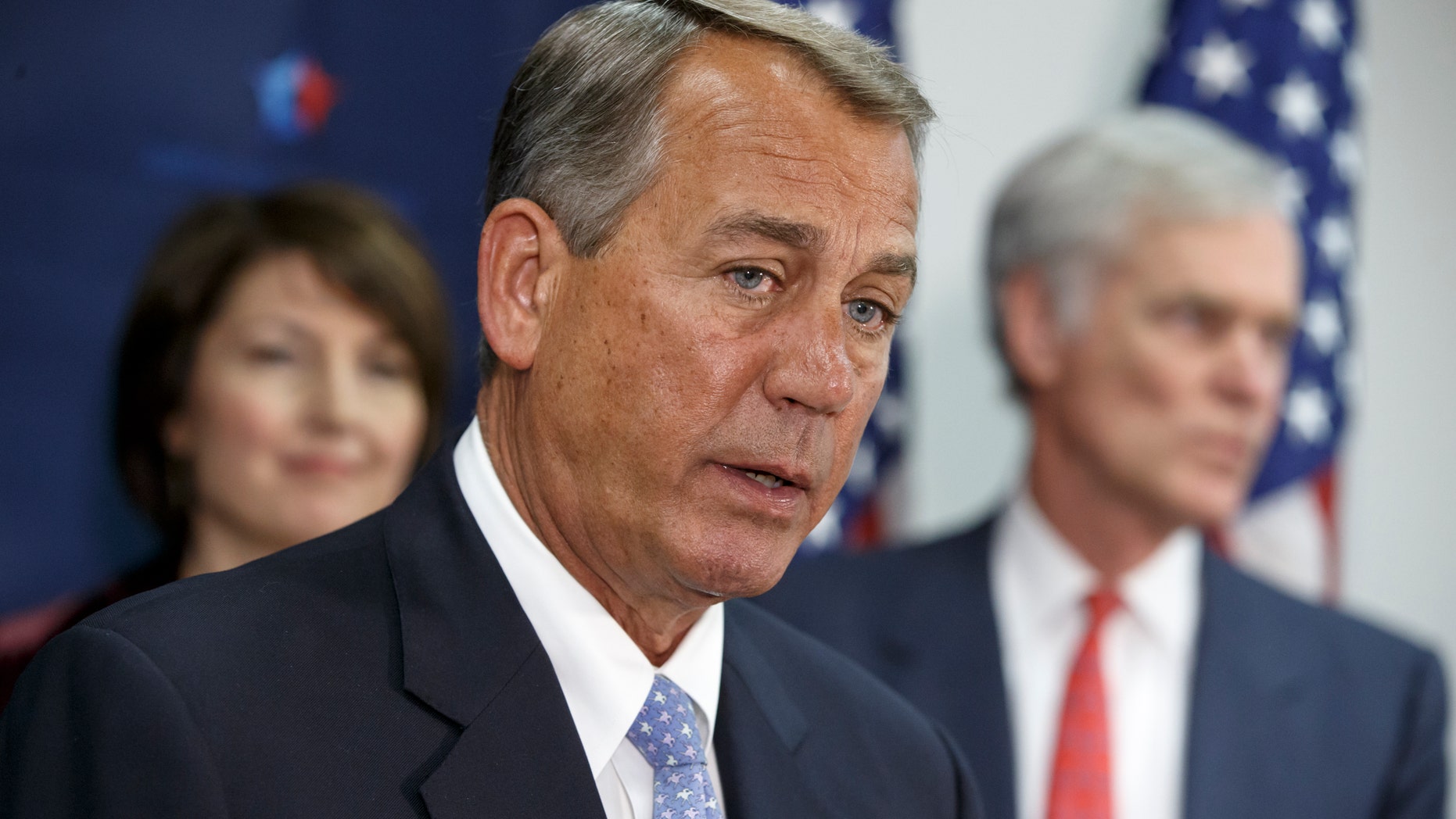 House Speaker John Boehner of Ohio, flanked by Rep. Cathy McMorris Rodgers, R-Wash., chair of the Republican Conference, left, and Rep. Ander Crenshaw, R-Fla., meets with reporters on Capitol Hill in Washington, Tuesday, Dec. 2, 2014, following a House Republican caucus meeting. Just days before government funding expires, House Republican leaders are trying to strike a balance between the conservatives determined to stop President Barack Obamas immigration order and other lawmakers just as determined to avoid another politically damaging shutdown. (AP Photo/J. Scott Applewhite)