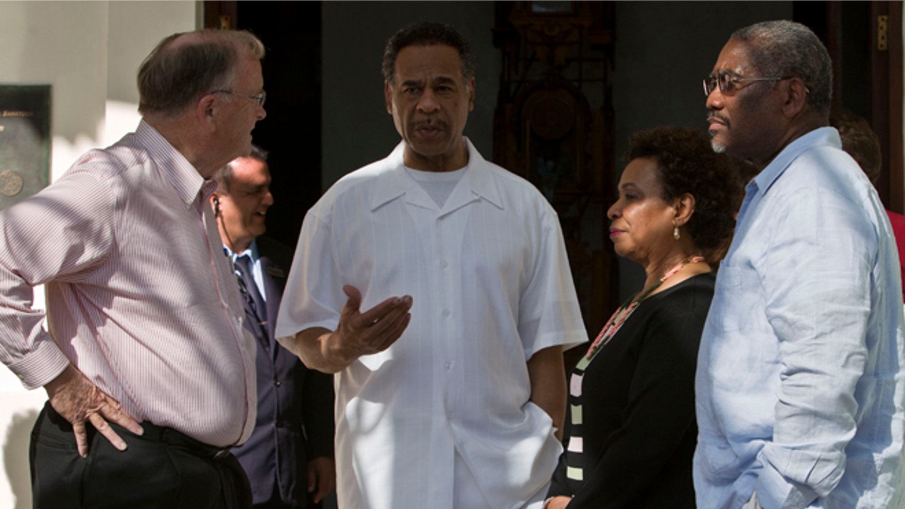 Congressman Emanuel Cleaver, center, speaks to Congressman Sam Farr, left, Congresswoman, Barbara Lee, second from right, and Congressman Gregory Meeks outside the Hotel Saratoga in Havana, Cuba, Monday, May 5, 2014. The congressmen had previously spoken at a press conference about imprisoned U.S. government subcontractor Alan Gross. (AP Photo/Franklin Reyes)
