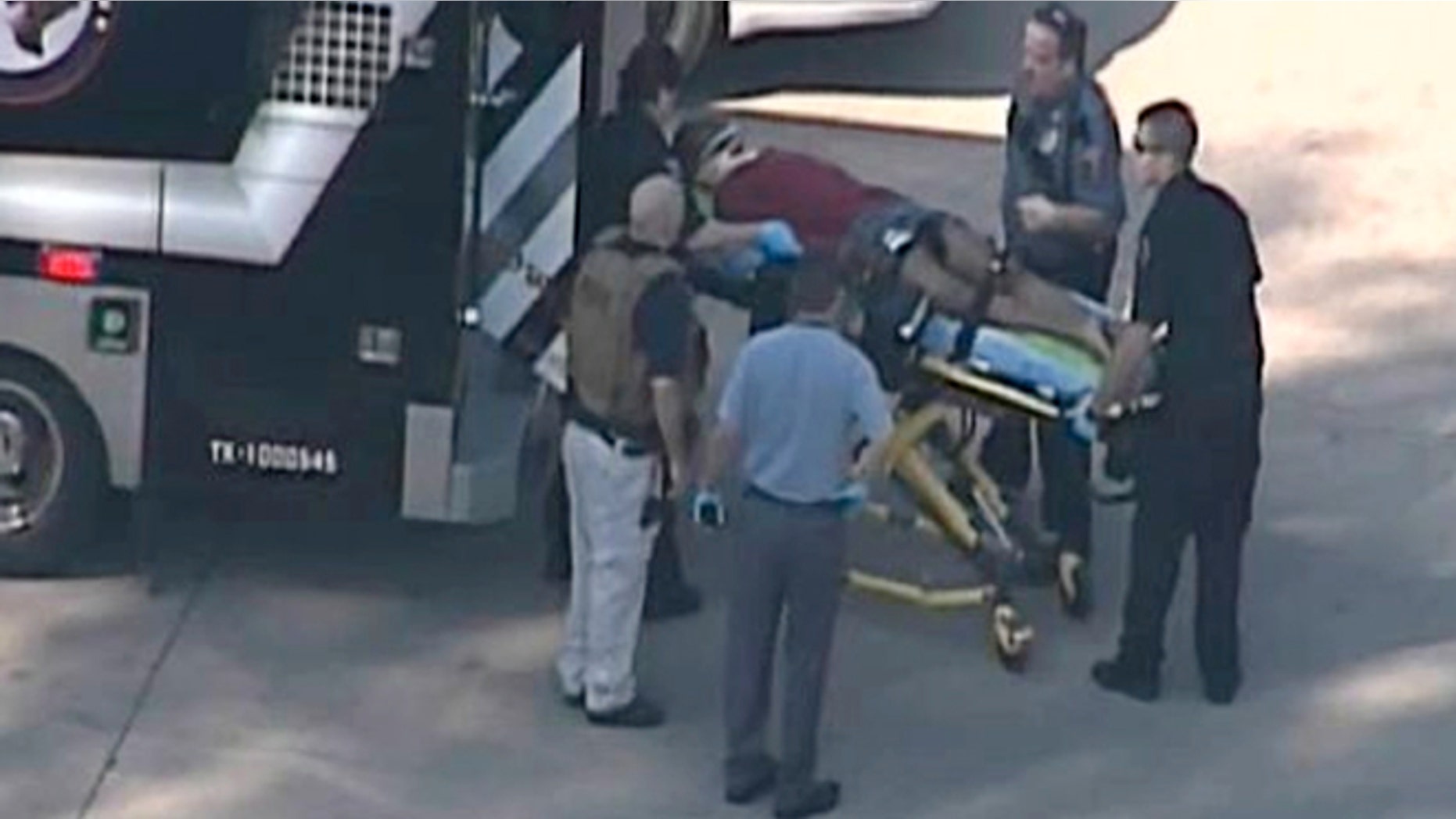 Jan. 22, 2013: In this frame grab provided by KPRC Houston, an unidentified person is transported by emergency personnel at Lone Star College Tuesday in Houston, where law enforcement officials say the community college is on lockdown amid reports of a shooter on campus.