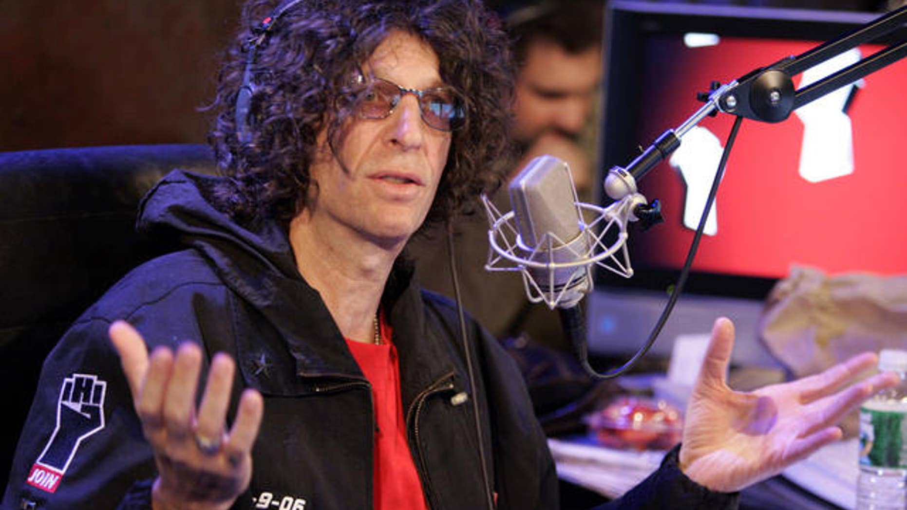 Radio personality Howard Stern responds to a question at an on-air news conference during his debut show on Sirius Satellite Radio, in New York, Monday Jan. 9, 2006. (AP Photo/Richard Drew)