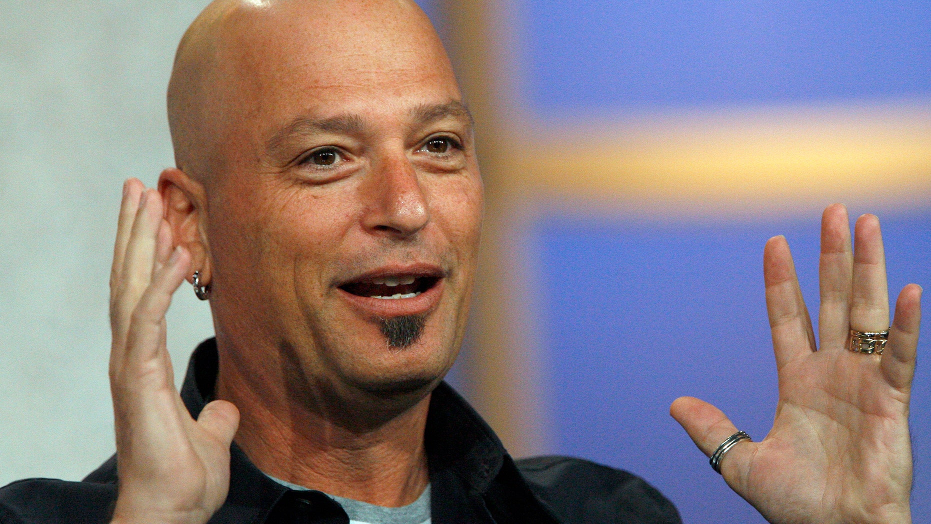 Host Howie Mandel gestures at the panel for the NBC television show
"Deal Or No Deal" at the Television Critics Association summer 2006 media tour. (REUTERS/Mario Anzuoni)