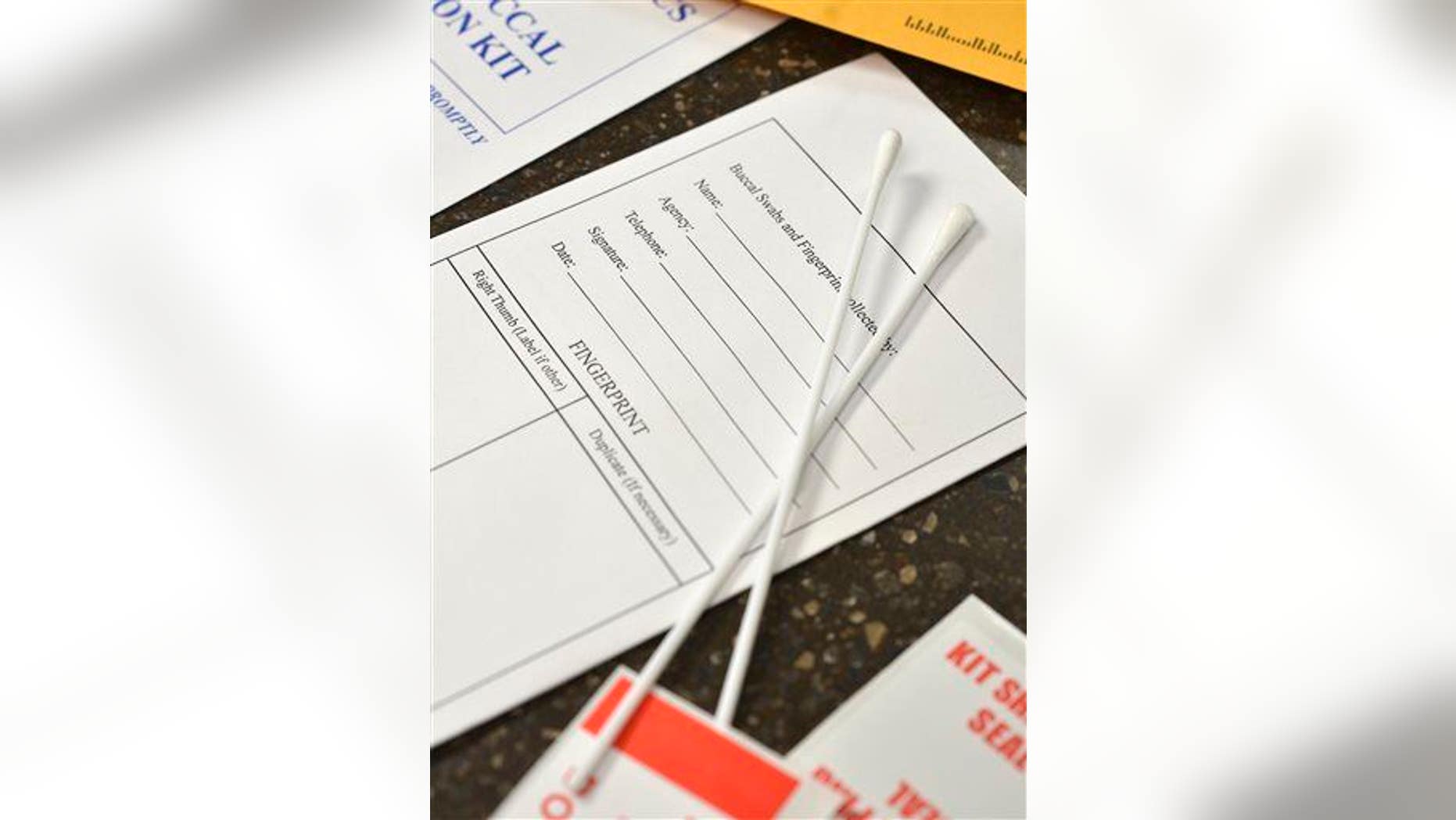 Swabs from a DNA sample collection kit are shown at the Iowa Department of Correction's Residential Treatment Facility in Sioux City, Iowa, Tuesday, Nov. 5, 2013.