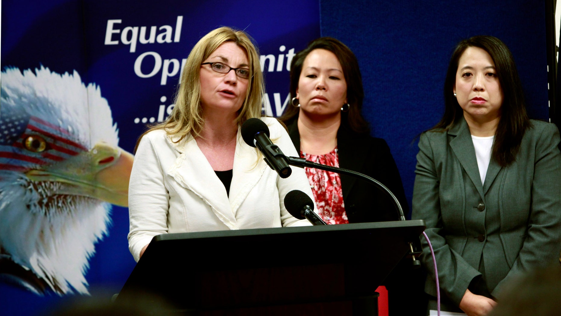 April 20: Kay Buck, left, executive director of the Coalition to Abolish Slavery Trafficking, speaks at a news conference to announce the filing of a human trafficking lawsuit that stretches across California , Hawaii, and Washington. Anna Park, regional attorney for the EEOC in the Los Angeles District, center, and Chanchanit Martorell, executive director for the Thai Community Development Center, listens in. (AP)
