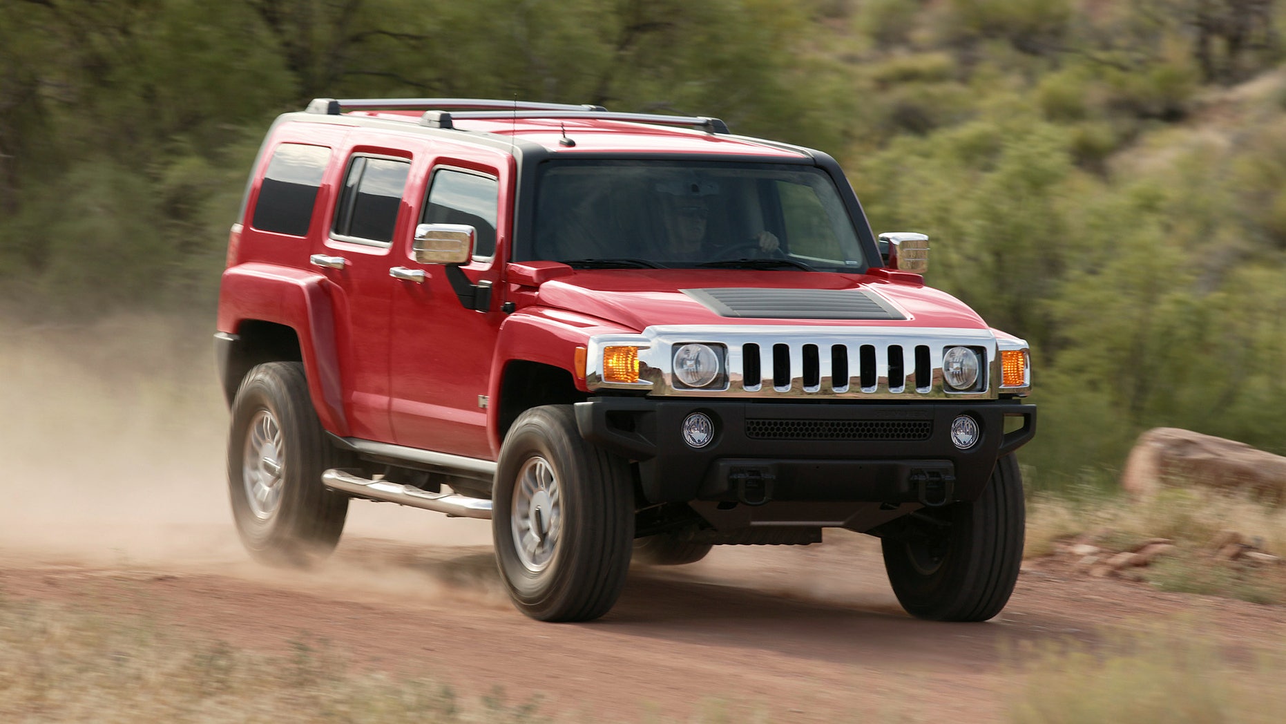 FILE - In this undated photo provided by General Motors a 2006 Hummer H3 is driven