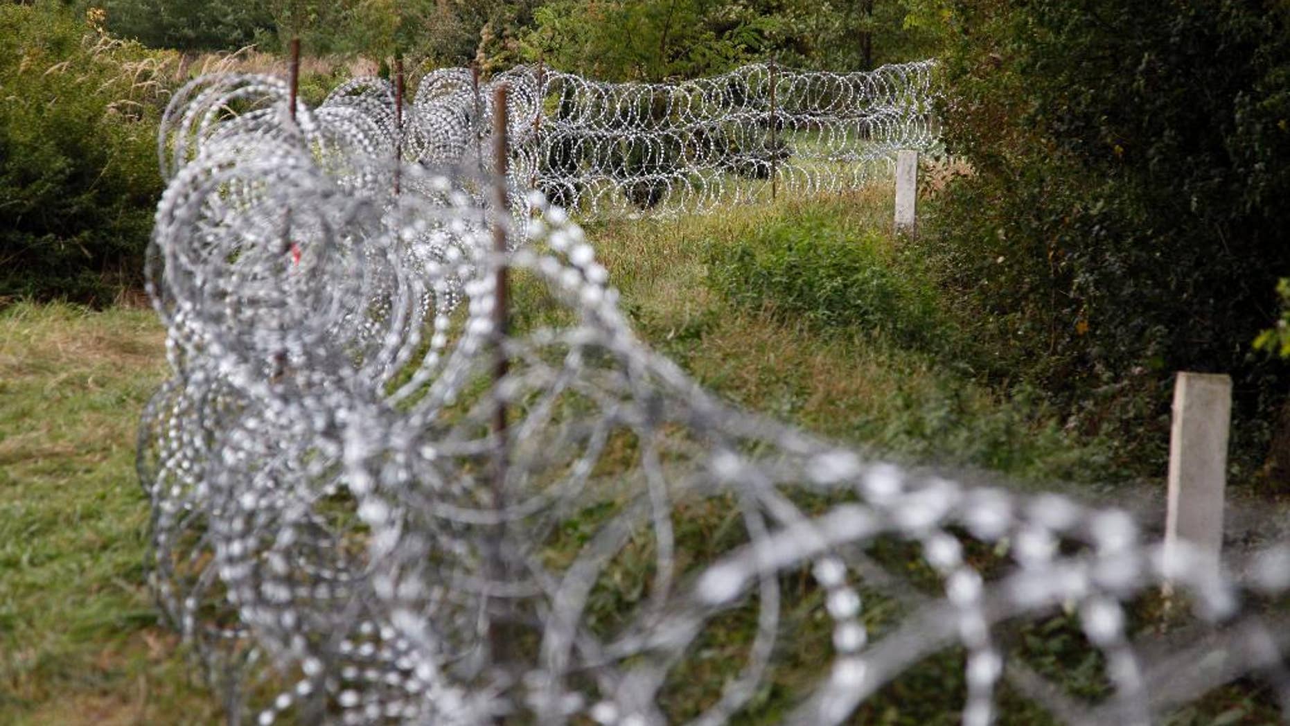 A part of the temporary fence is seen at the green border between Hungary and Croatia at Zakany, 234 kms southwest of Budapest, Hungary, Tuesday, Sept. 29, 2015. (Gyorgy Varga/MTI via AP)