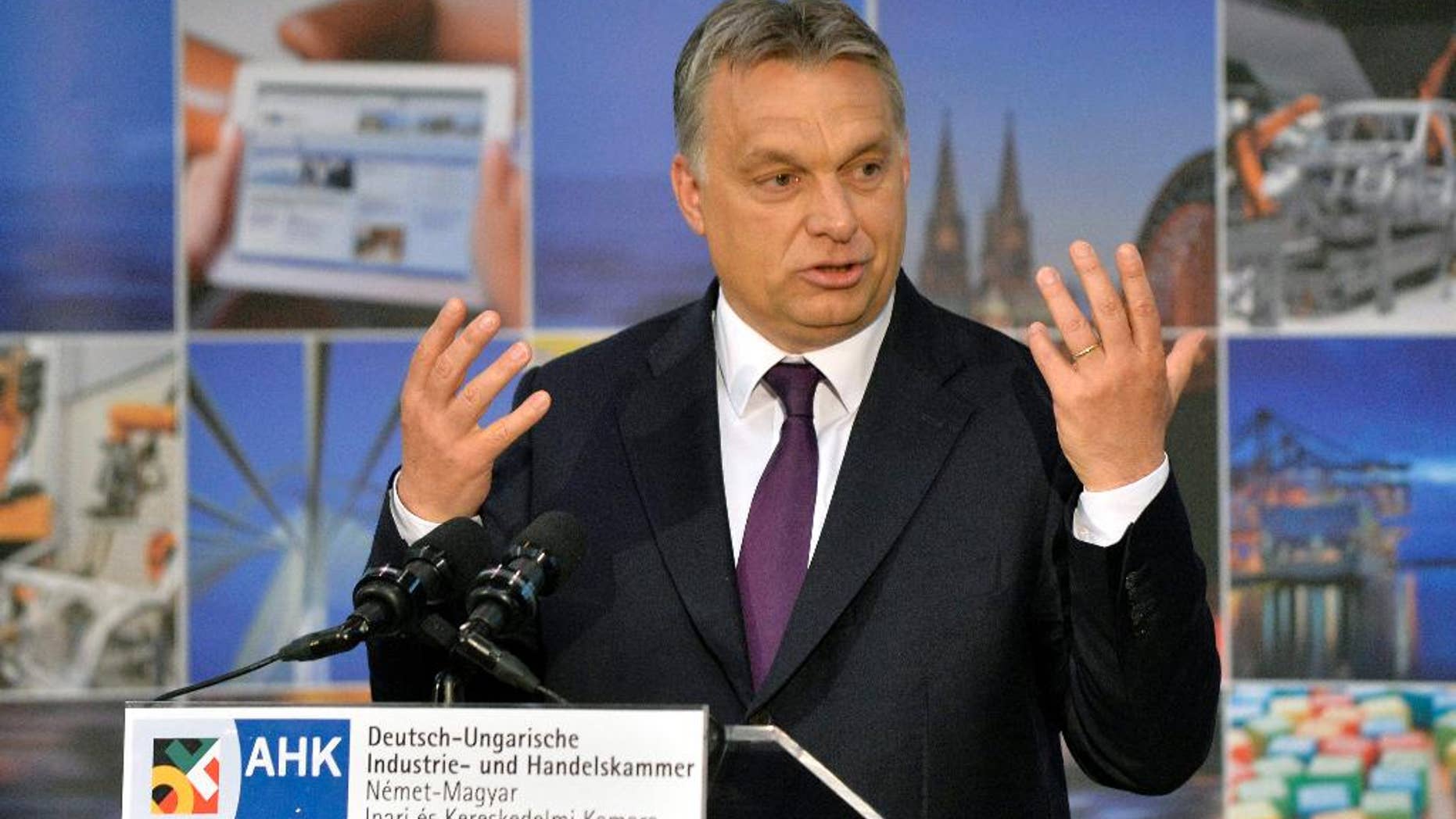 Hungarian Prime Minister Viktor Orban addresses the annual meeting of the German-Hungarian Chamber of Commerce and Industry in the Budapest Business School in Budapest, Hungary, Thursday, May 7, 2015. ( Zoltan Mathe/MTI via AP)