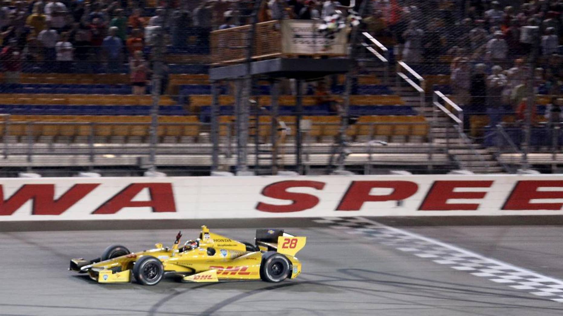 FILE - In this July 12, 2014, file photo, Ryan Hunter-Reay crosses the finish line to win the Indy Car series event in Newton, Iowa. Hunter-Reay is hoping that a return to the site of his last win will jumpstart a disappointing season. (AP Photo/Justin Hayworth, File)
