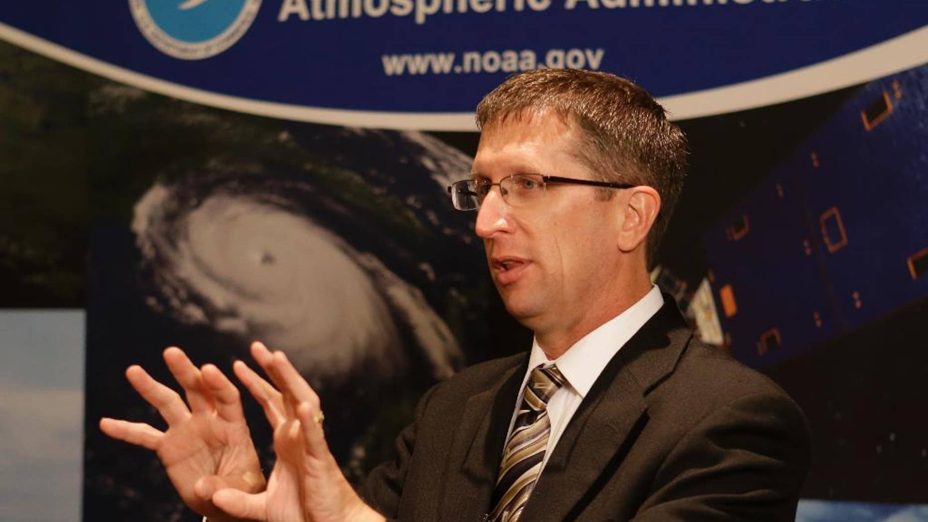 Rick Knabb, director of the National Hurricane Center, speaks about new color-coded maps that will help coastal residents understand the dangers of storm surge during the upcoming storm season at the 2014 National Hurricane Conference, Tuesday, April 15, 2014, in Orlando, Fla. Knabb is joining emergency managers and forecasters from Texas to Maine this week at the conference. (AP Photo/John Raoux)