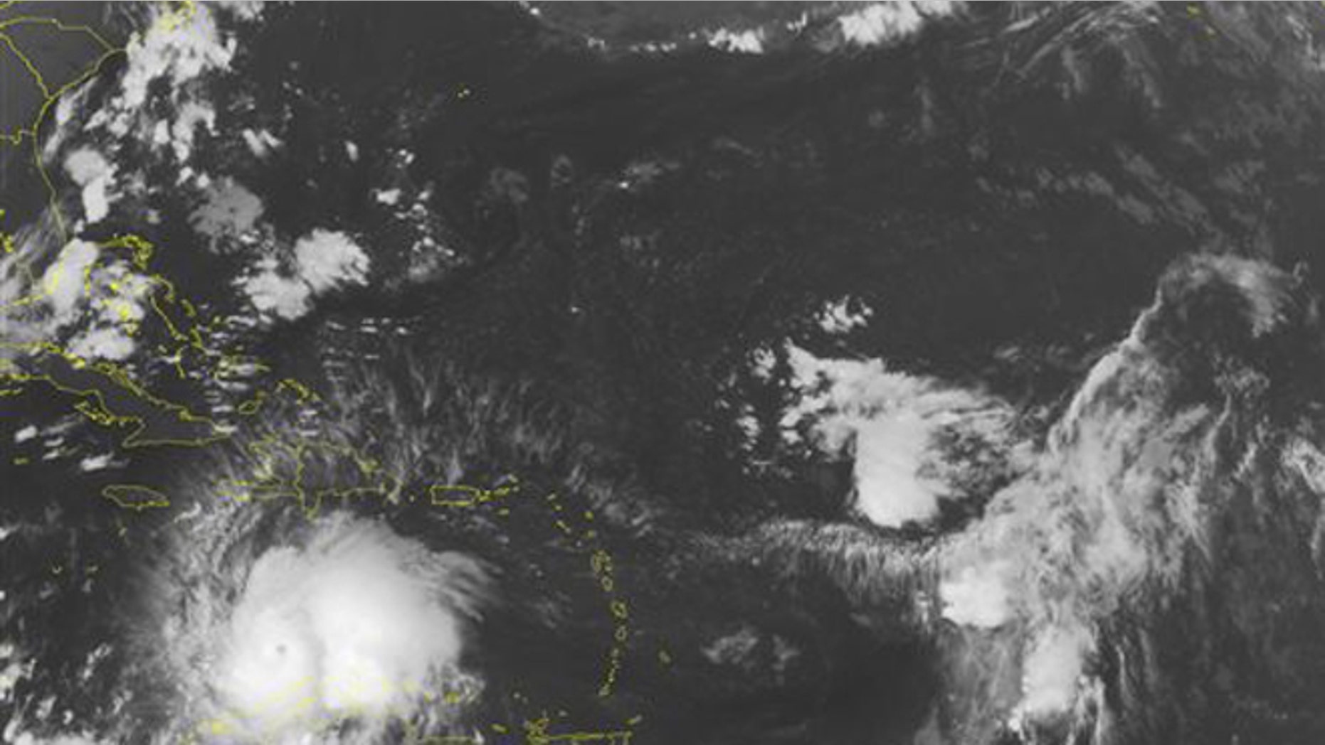 This NOAA satellite image taken Saturday, Oct. 1, 2016 at 12:45 AM EDT shows well defined Hurricane Matthew continuing to slowly move westward at about 7 MPH across the Caribbean. Recent reconnaissance missions have revealed max sustained wind speeds up to 160 MPH, bringing Matthew up to a category 5 hurricane. Some of the outer bands can be seen pushing into Hispaniola, as well as Venezuela and Columbia. Matthew is expected to begin its northward turn over the next few days, largely impacting Jamaica next. (NOAA/Weather Underground via AP)