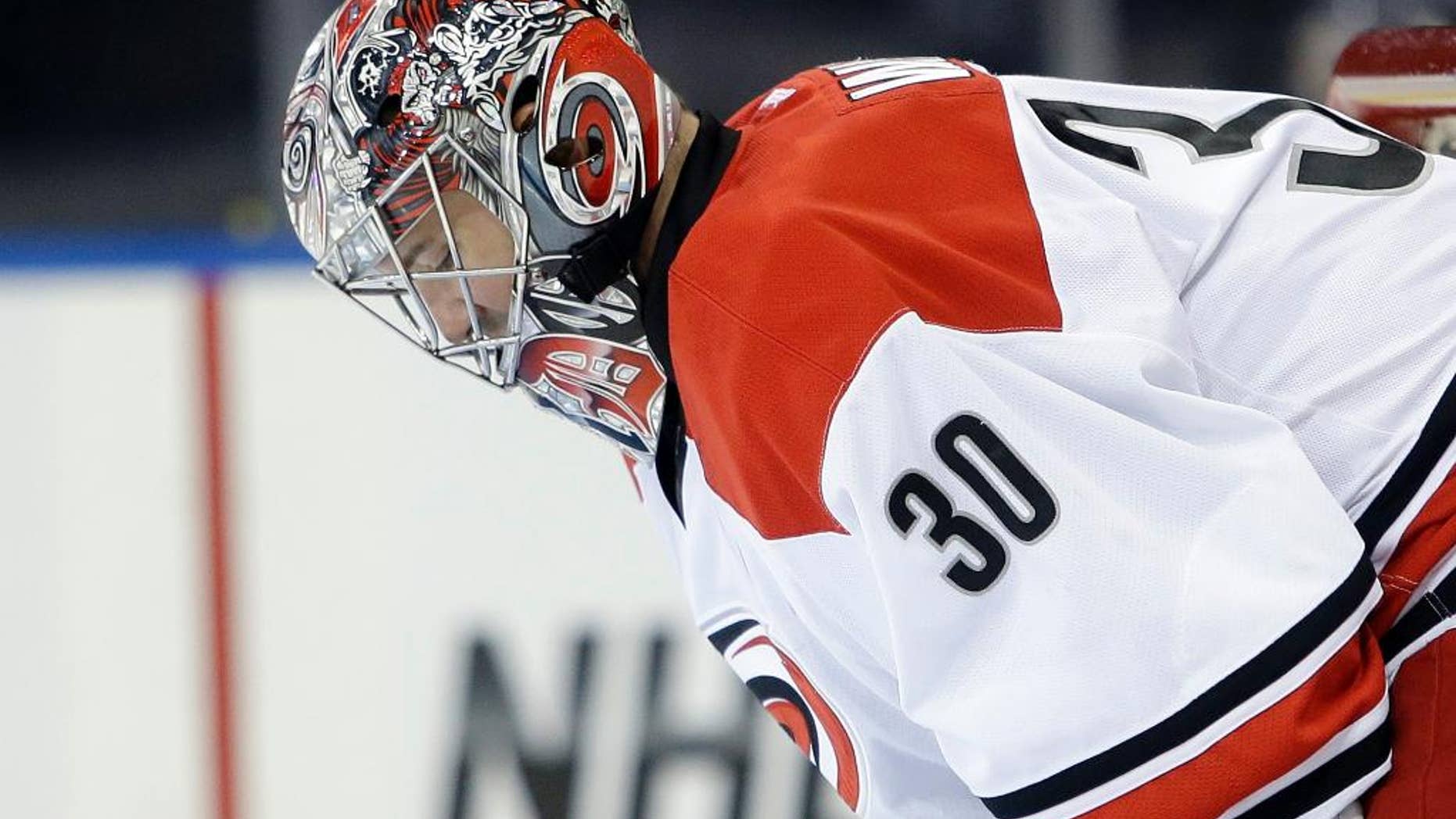 Carolina Hurricanes goalie Cam Ward looks down after New York Rangers' Benoit Pouliot scored during the second period of an NHL hockey game Tuesday, April 8, 2014, in New York. (AP Photo/Frank Franklin II)
